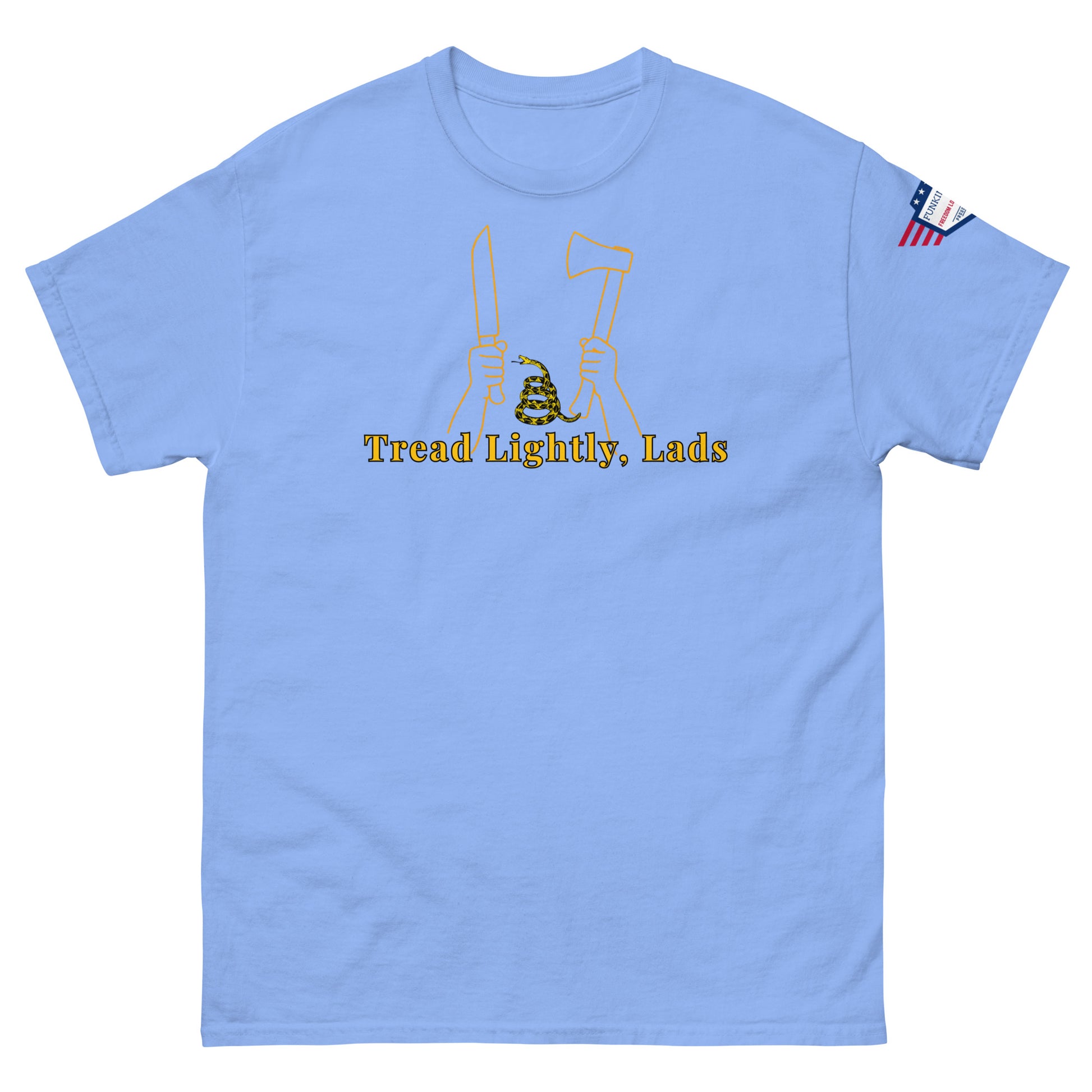 Front view of light blue unisex tee with gold "Tread Lightly, Lads" print, hands gripping knife & axe around coiled Gadsden snake, US flag sleeve patch