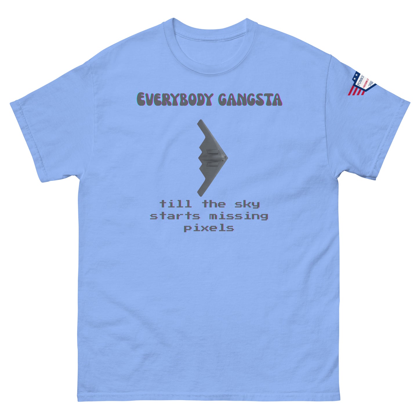 Front view of light blue unisex tee with purple "Everybody Gangsta" text, gray stealth bomber graphic, teal "till the sky starts missing pixels" glitch print, flag sleeve patch