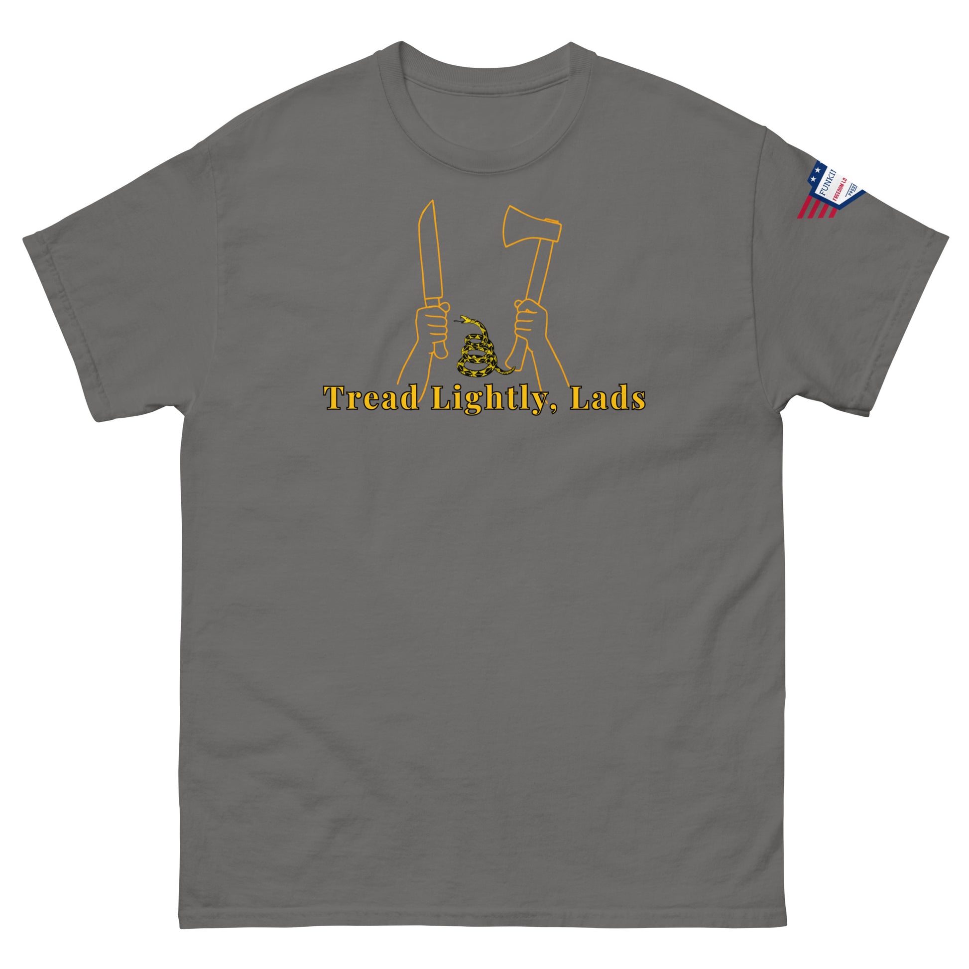 Front view of medium gray unisex tee with gold "Tread Lightly, Lads" print, hands gripping knife & axe around coiled Gadsden snake, US flag sleeve patch