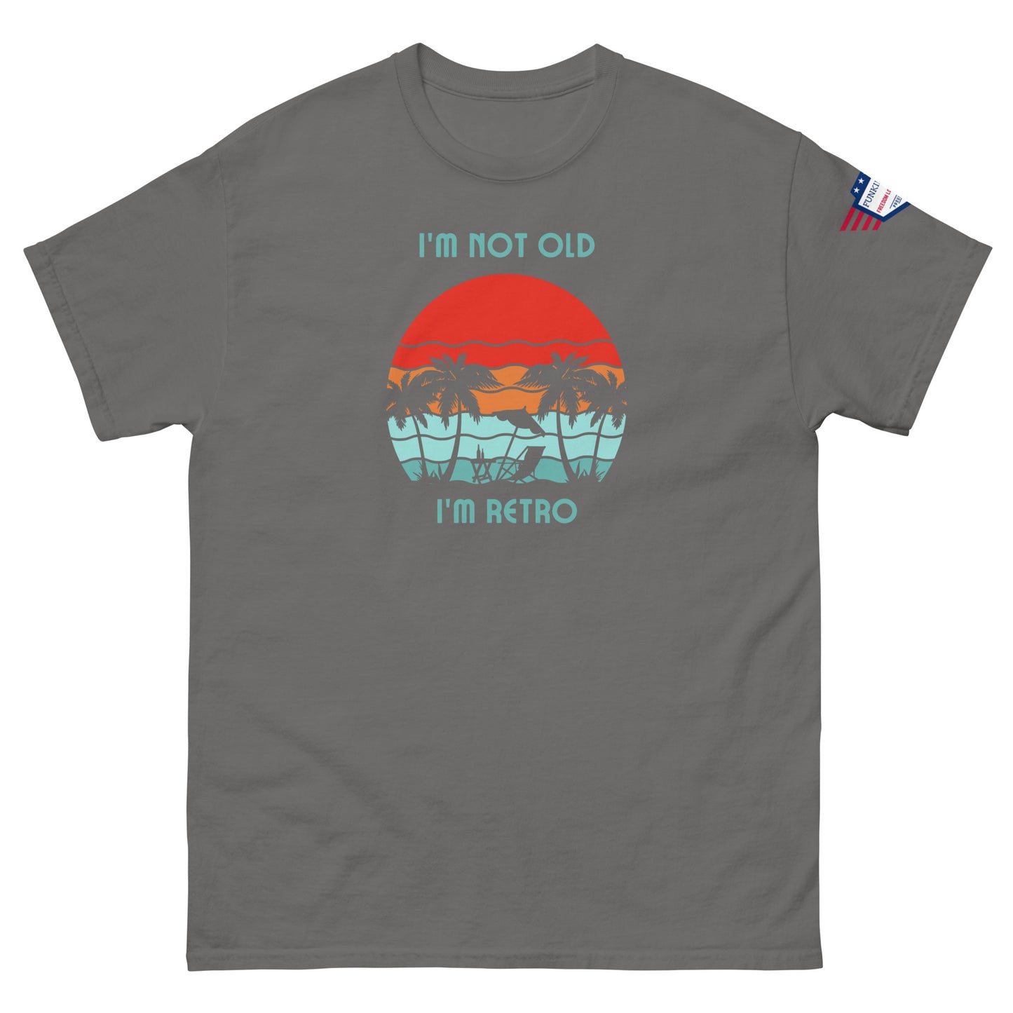 Front view of dark gray unisex t-shirt with "I'm not old I'm retro" print and colorful hammock sunset graphic, US flag sleeve