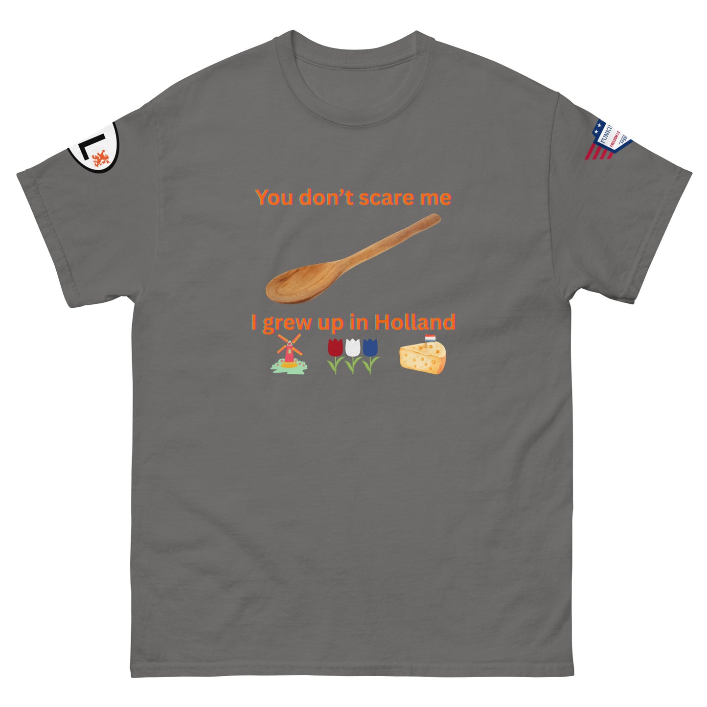 Front view of heather gray unisex tee with orange "You don't scare me, I grew up in Holland" print, wooden spoon, windmill/tulip/cheese emojis, sleeve patches