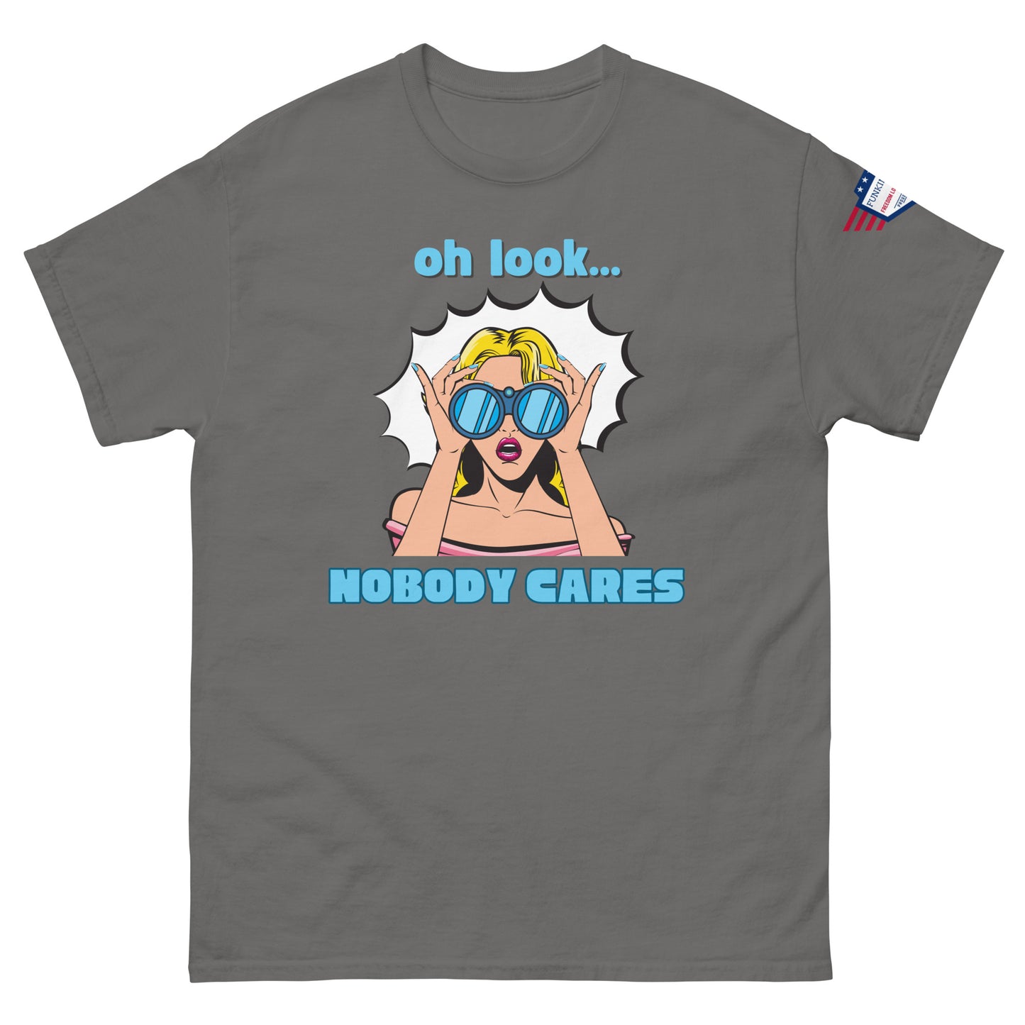 Front view of charcoal gray unisex t-shirt with cyan "Oh look..." text, pop-art blonde diva in blue shades yelling "NOBODY CARES", USA flag sleeve patch