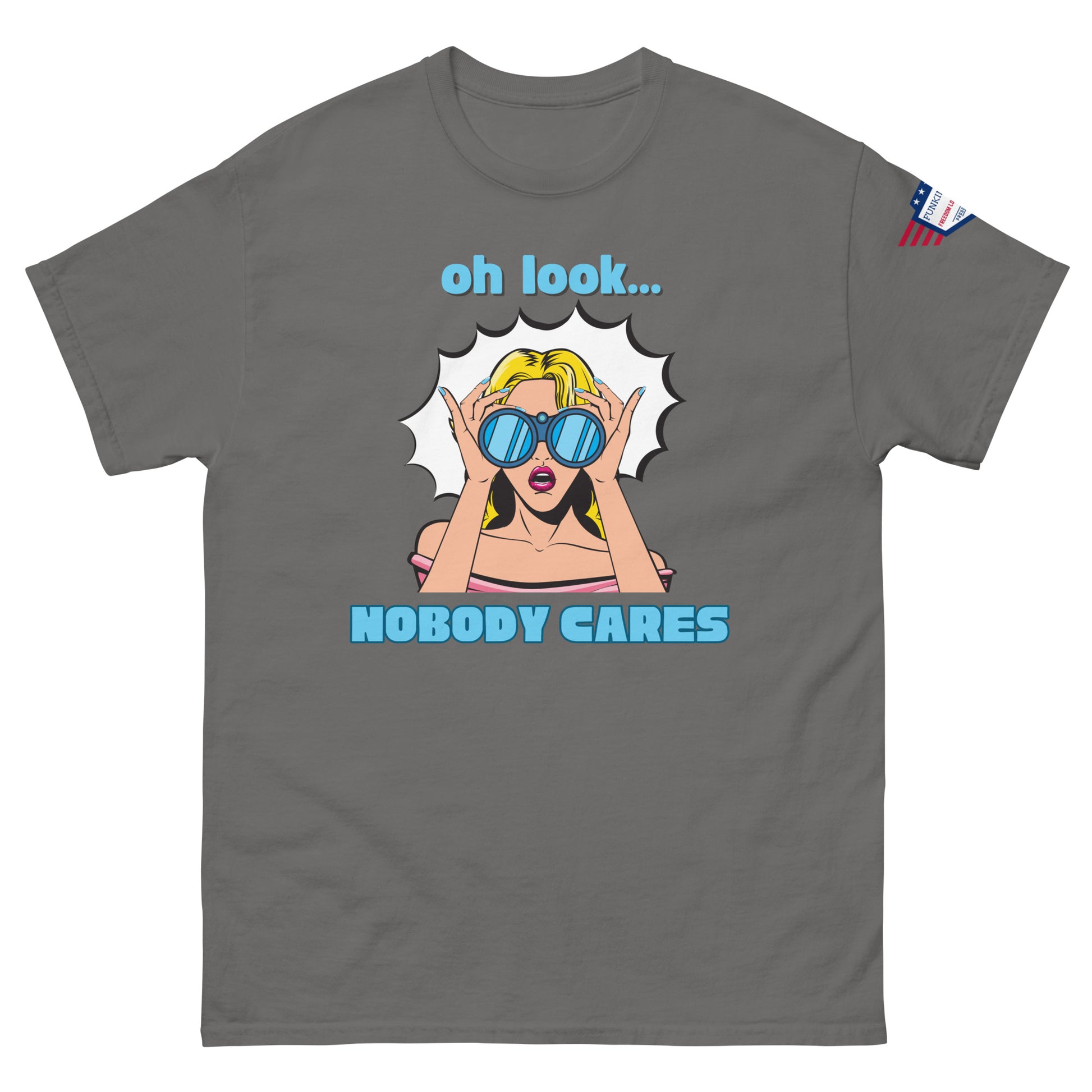Front view of charcoal gray unisex t-shirt with cyan "Oh look..." text, pop-art blonde diva in blue shades yelling "NOBODY CARES", USA flag sleeve patch