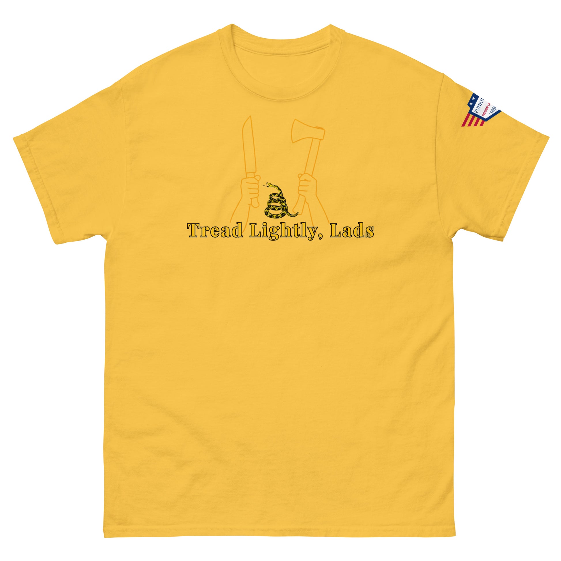 Front view of mustard yellow unisex tee with gold "Tread Lightly, Lads" print, hands gripping knife & axe around coiled Gadsden snake, US flag sleeve patch
