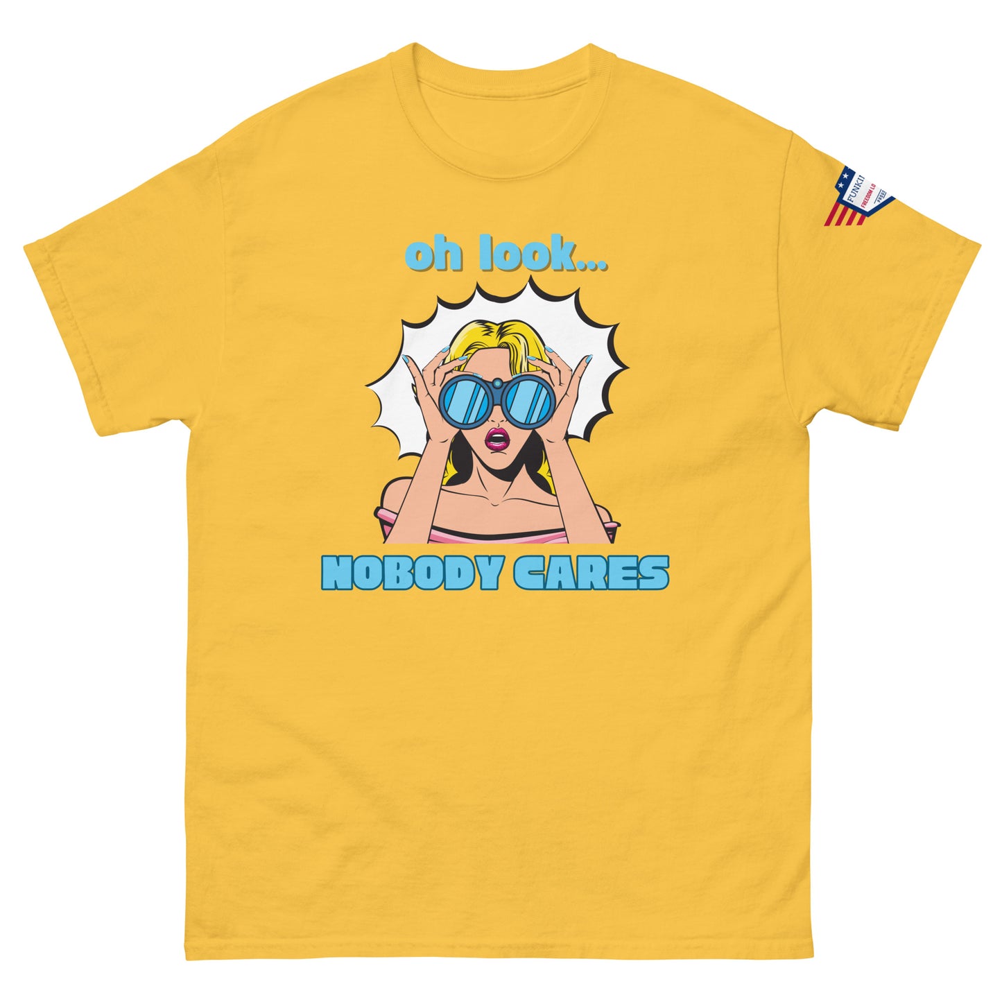 Front view of mustard yellow unisex t-shirt with cyan "Oh look..." text, pop-art blonde diva in blue shades yelling "NOBODY CARES", USA flag sleeve patch
