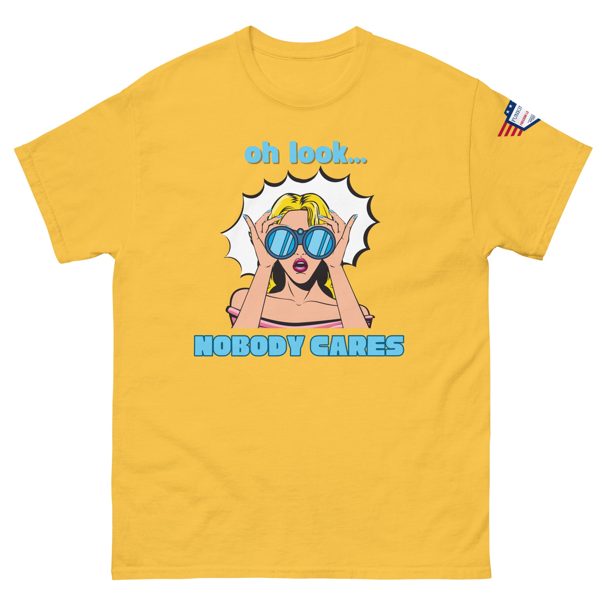 Front view of mustard yellow unisex t-shirt with cyan "Oh look..." text, pop-art blonde diva in blue shades yelling "NOBODY CARES", USA flag sleeve patch