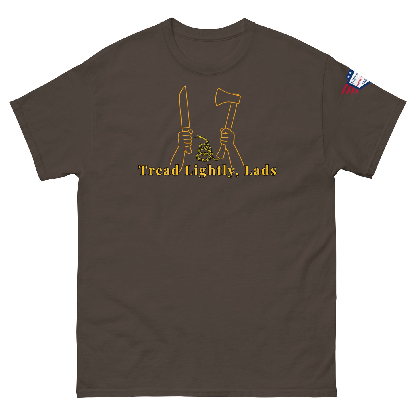 Front view of dark brown unisex tee with gold "Tread Lightly, Lads" print, hands gripping knife & axe around coiled Gadsden snake, US flag sleeve patch