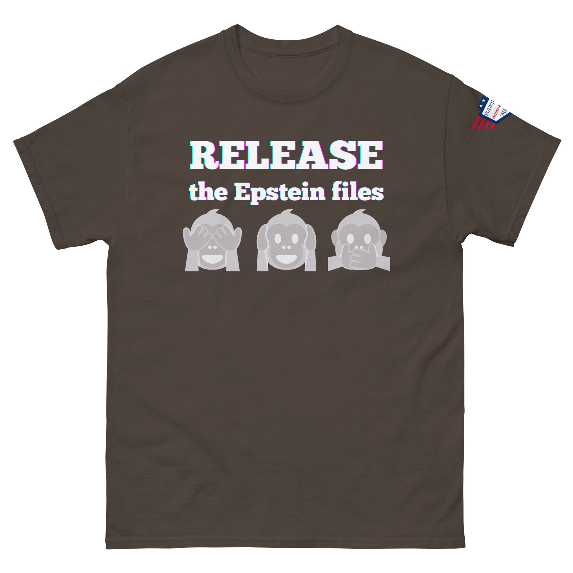 Front view of dark brown unisex t-shirt with "RELEASE the Epstein files" glow text, see-no-speak monkeys, USA patch