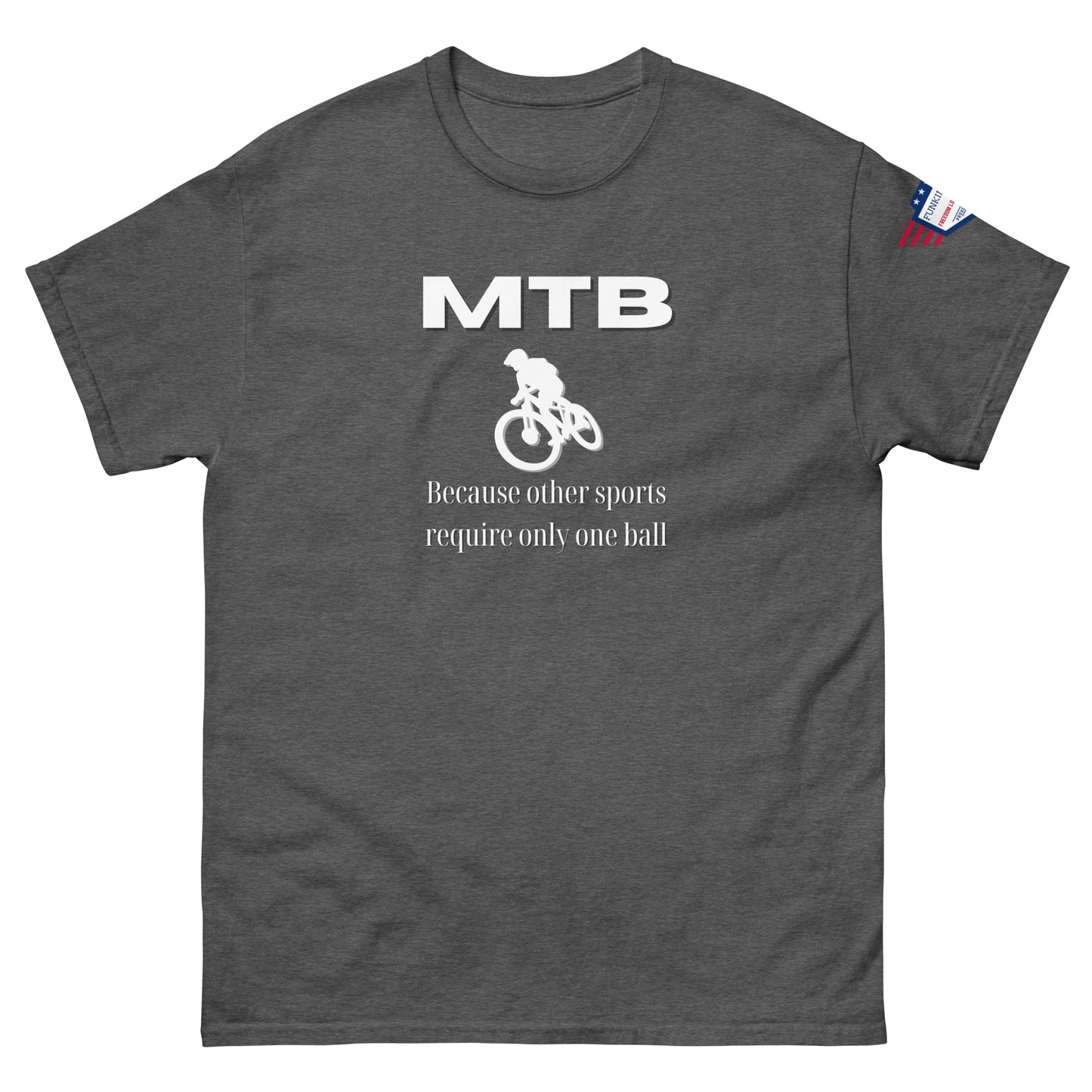 Front view of charcoal gray unisex t-shirt featuring white "MTB", biker graphic, "Because other sports require only one ball" text, flag patch