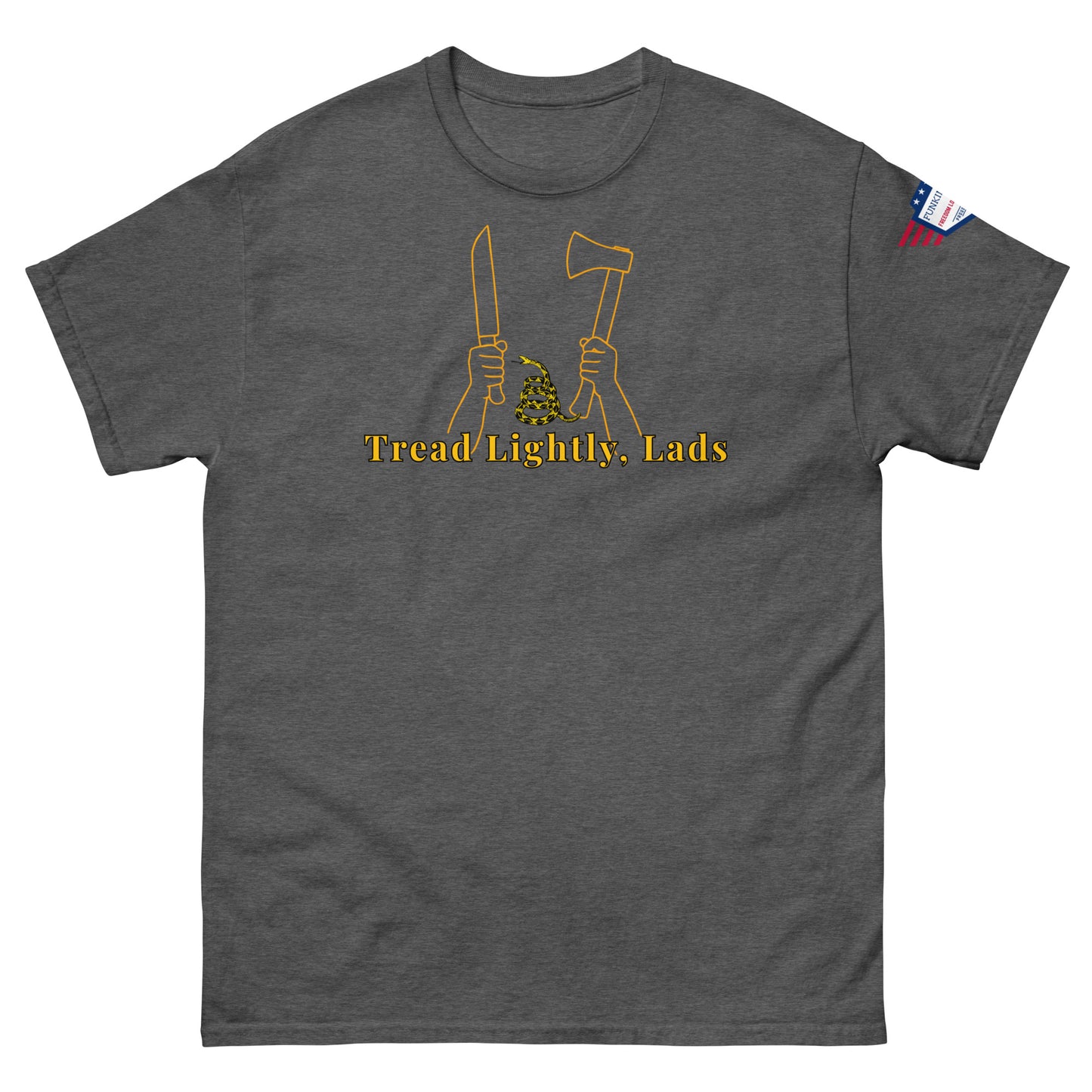 Front view of charcoal gray unisex tee with gold "Tread Lightly, Lads" print, hands gripping knife & axe around coiled Gadsden snake, US flag sleeve patch