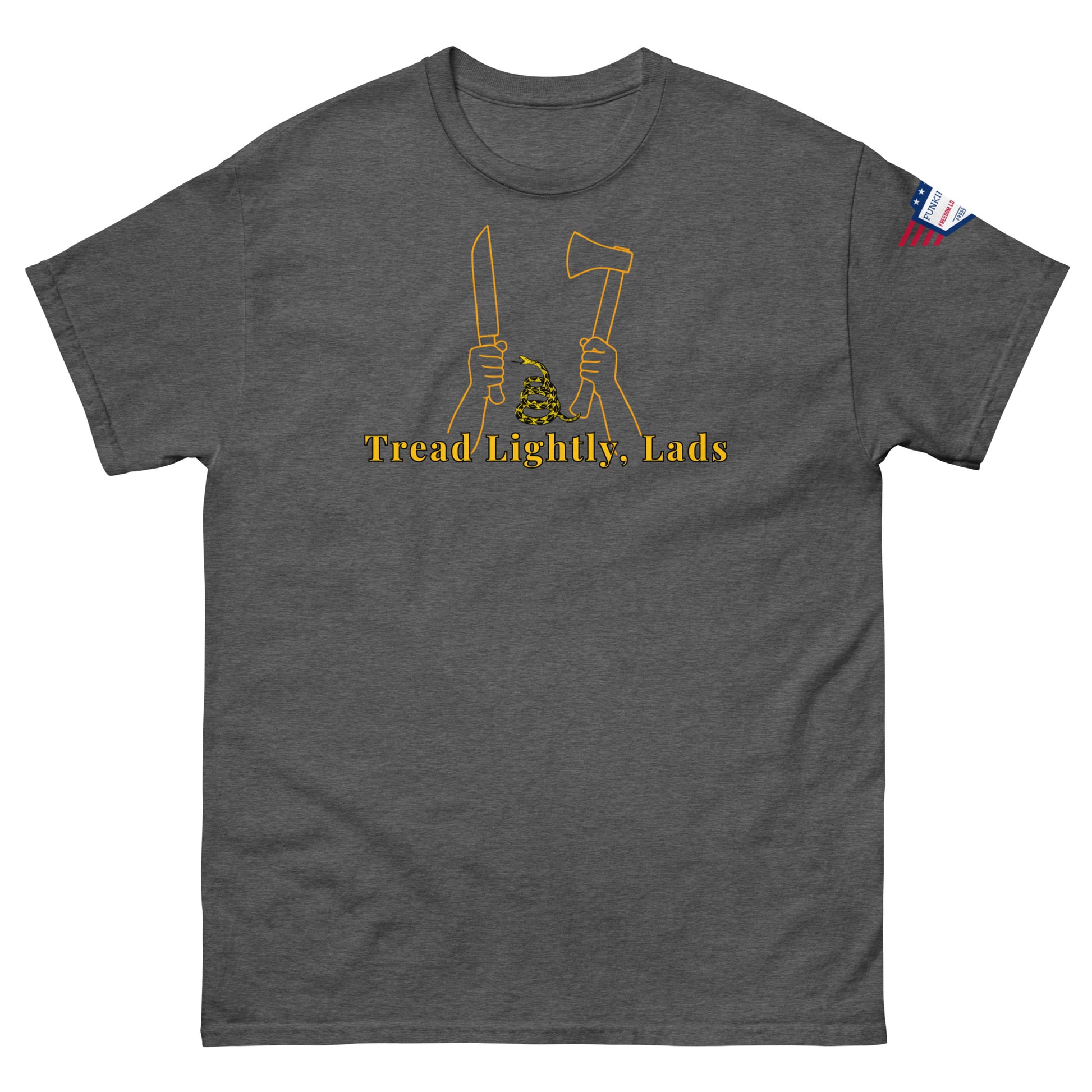 Front view of charcoal gray unisex tee with gold "Tread Lightly, Lads" print, hands gripping knife & axe around coiled Gadsden snake, US flag sleeve patch
