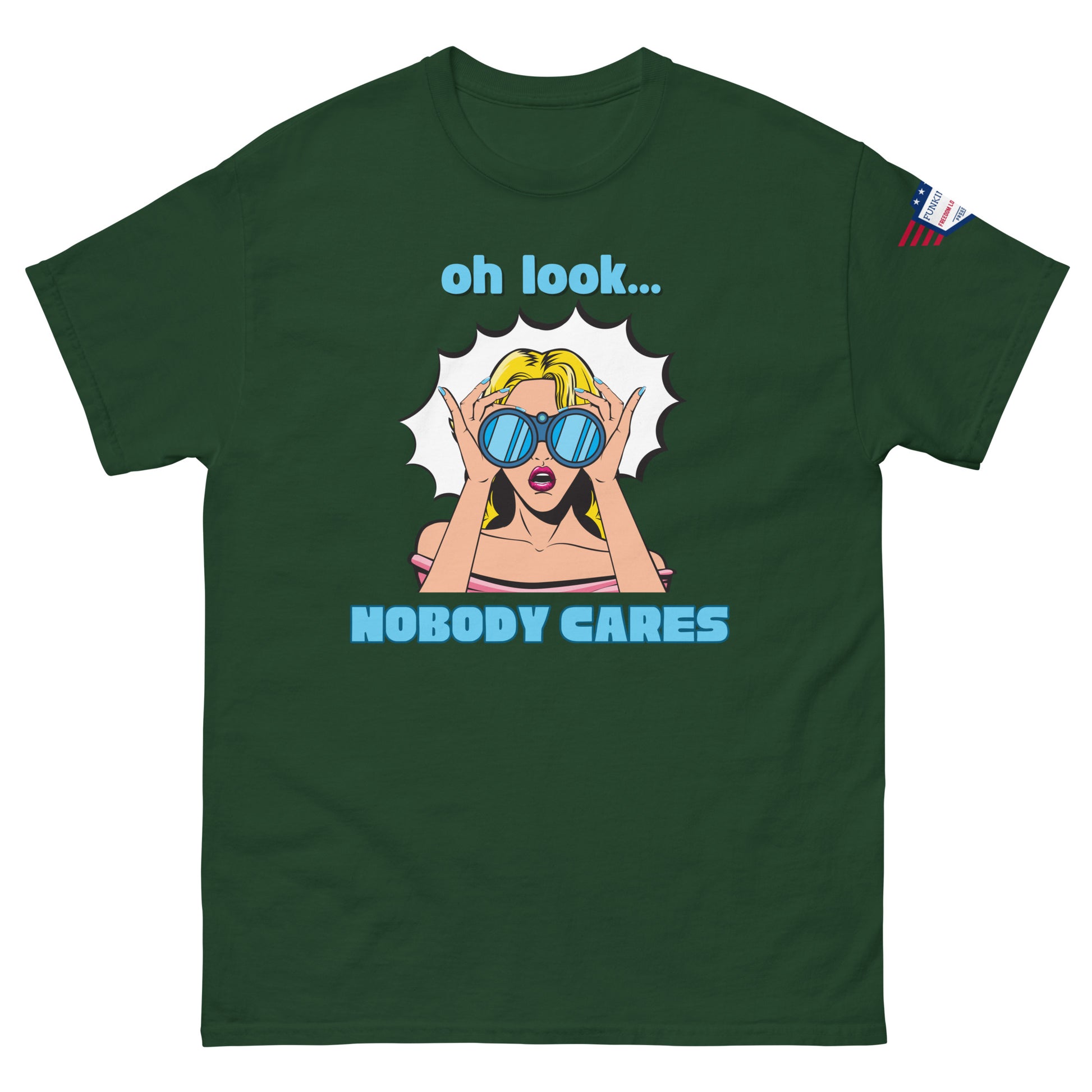 Front view of forest green unisex t-shirt with bold "oh look... NOBODY CARES" comic-style graphic and flag patch