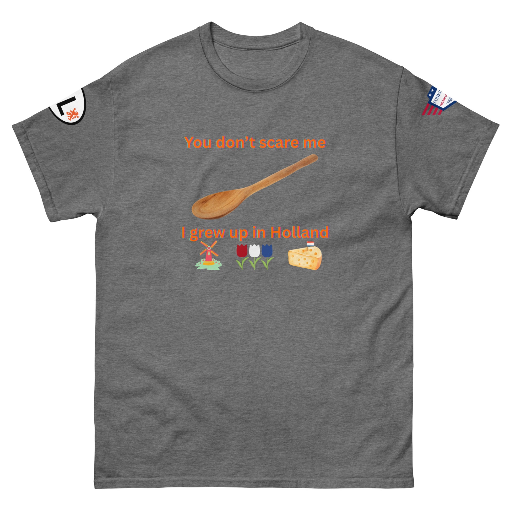 Front view of dark gray unisex tee showing orange "You don't scare me I grew up in Holland" design, spoon, Dutch windmill, tulips, cheese, arm labels