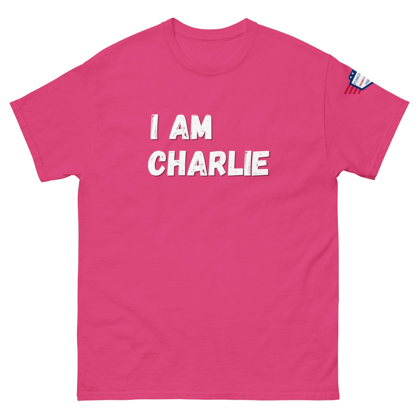 Front view of hot pink unisex tee with bold white "I AM CHARLIE" graphic and USA flag sleeve patch