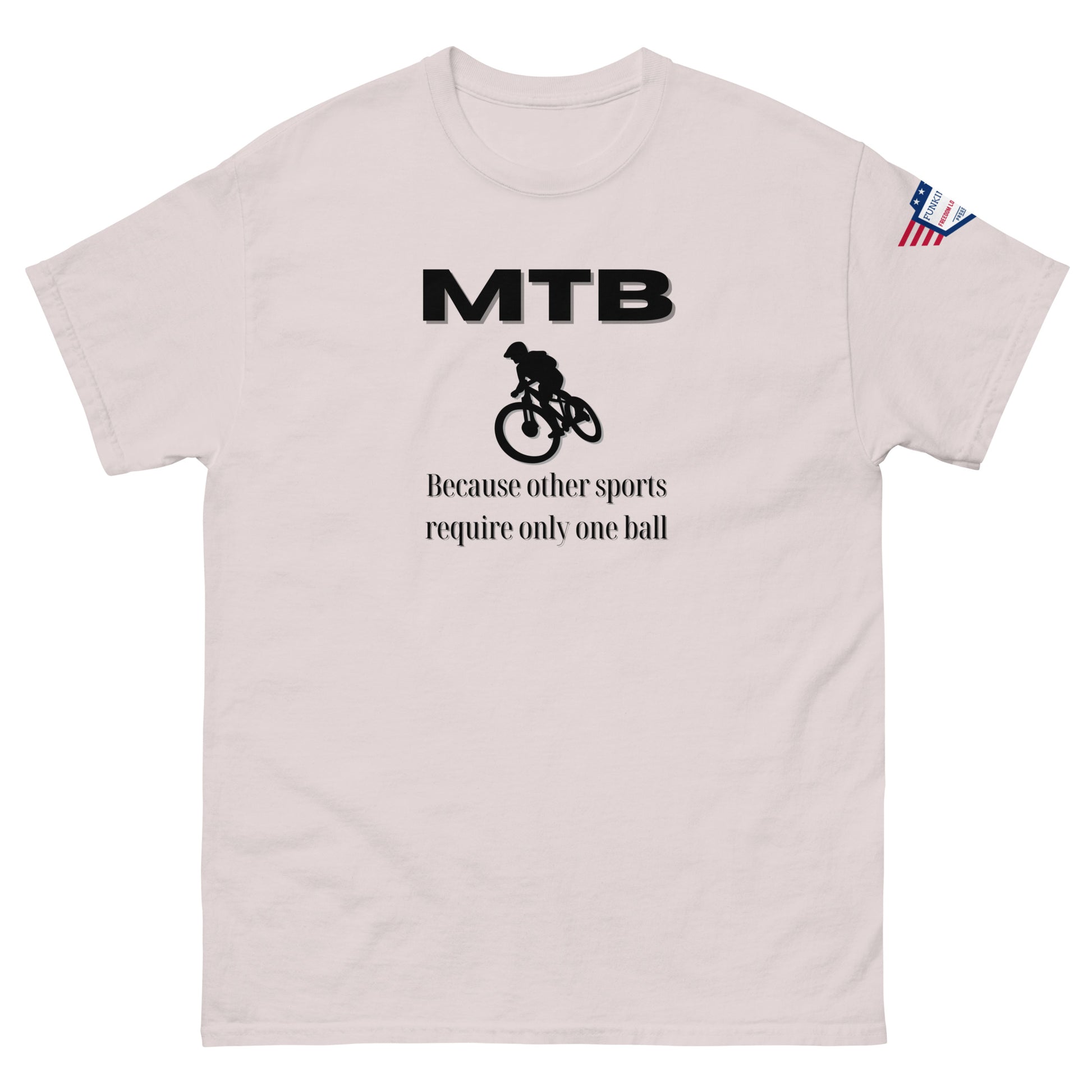 Front view of light ash classic unisex tee with bold black "MTB" print, biker silhouette, and "Because other sports require only one ball" text