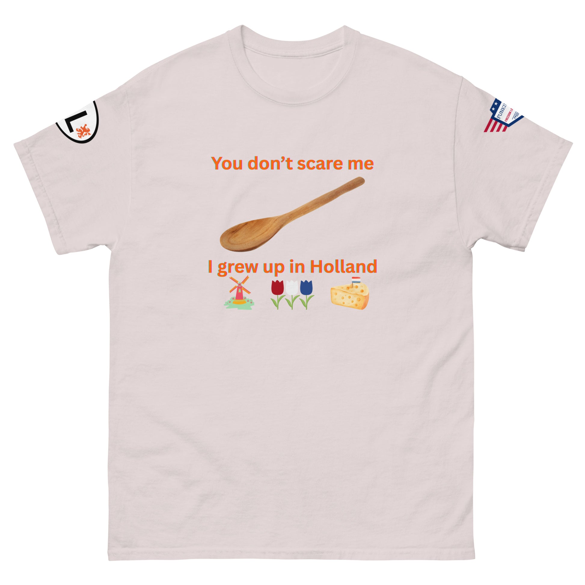 Front view of ash gray unisex tee with bold "You don't scare me I grew up in Holland" orange text, spoon, windmill, tulips, cheese, sleeve details