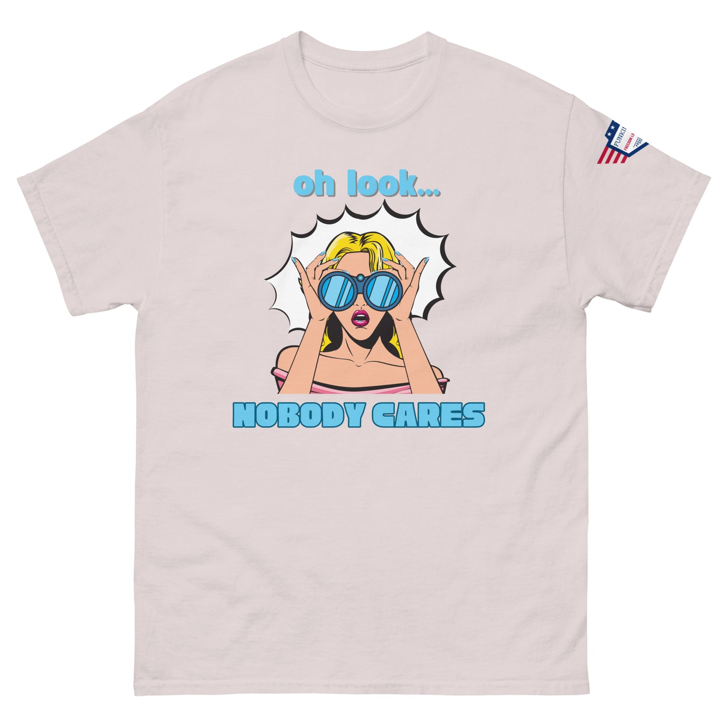 Front view of light ash unisex t-shirt showing "oh look... NOBODY CARES" sassy comic print and USA sleeve patch