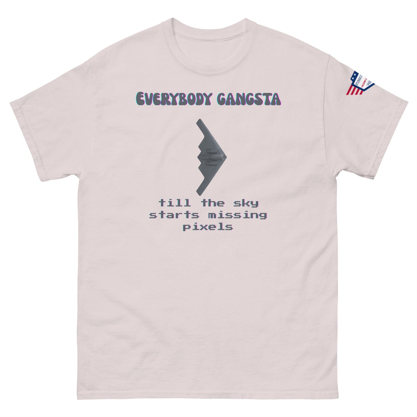 Front view of light pink unisex tee featuring purple "EVERYBODY GANGSTA", gray stealth wing, green "till the sky starts missing pixels"