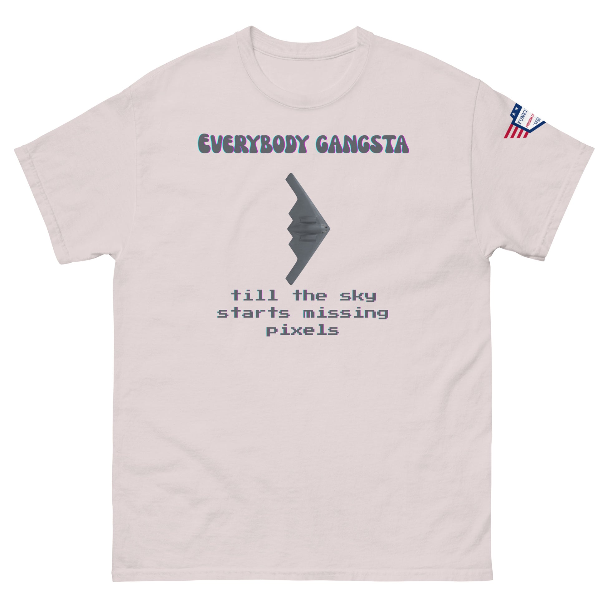 Front view of light pink unisex tee featuring purple "EVERYBODY GANGSTA", gray stealth wing, green "till the sky starts missing pixels"