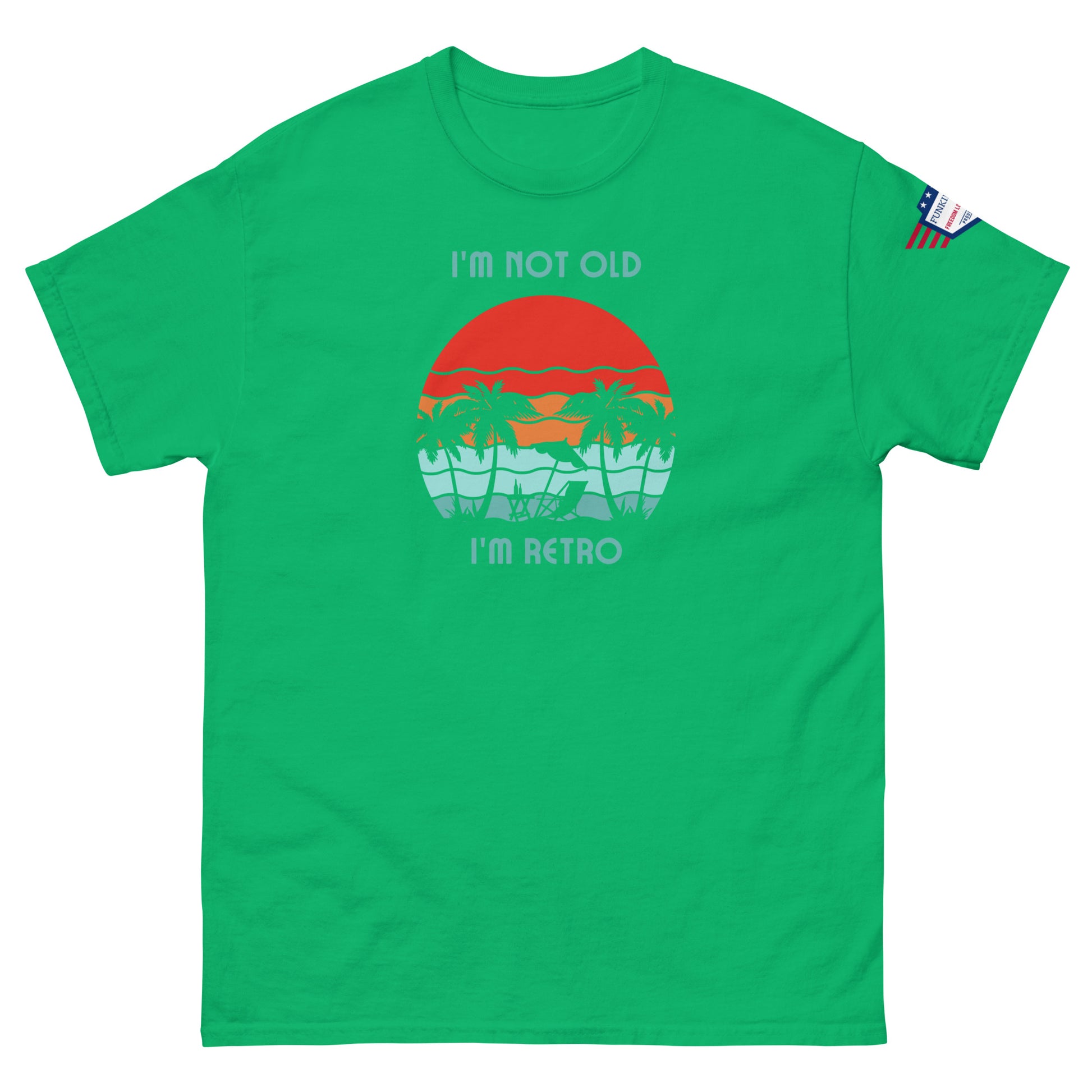 Front view of green unisex t-shirt with "I'm not old I'm retro" print and tropical orange sun graphic, flag sleeve patch
