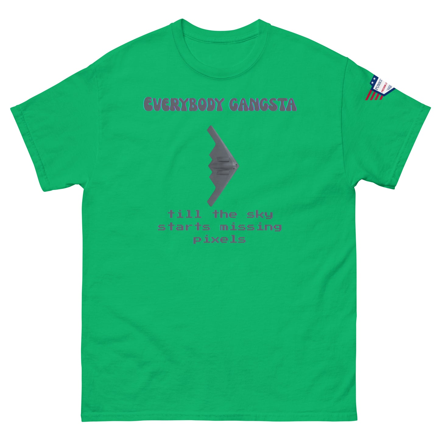 Front view of green unisex tee with purple "Everybody Gangsta" text, gray stealth bomber graphic, teal "till the sky starts missing pixels" glitch print, flag sleeve patch