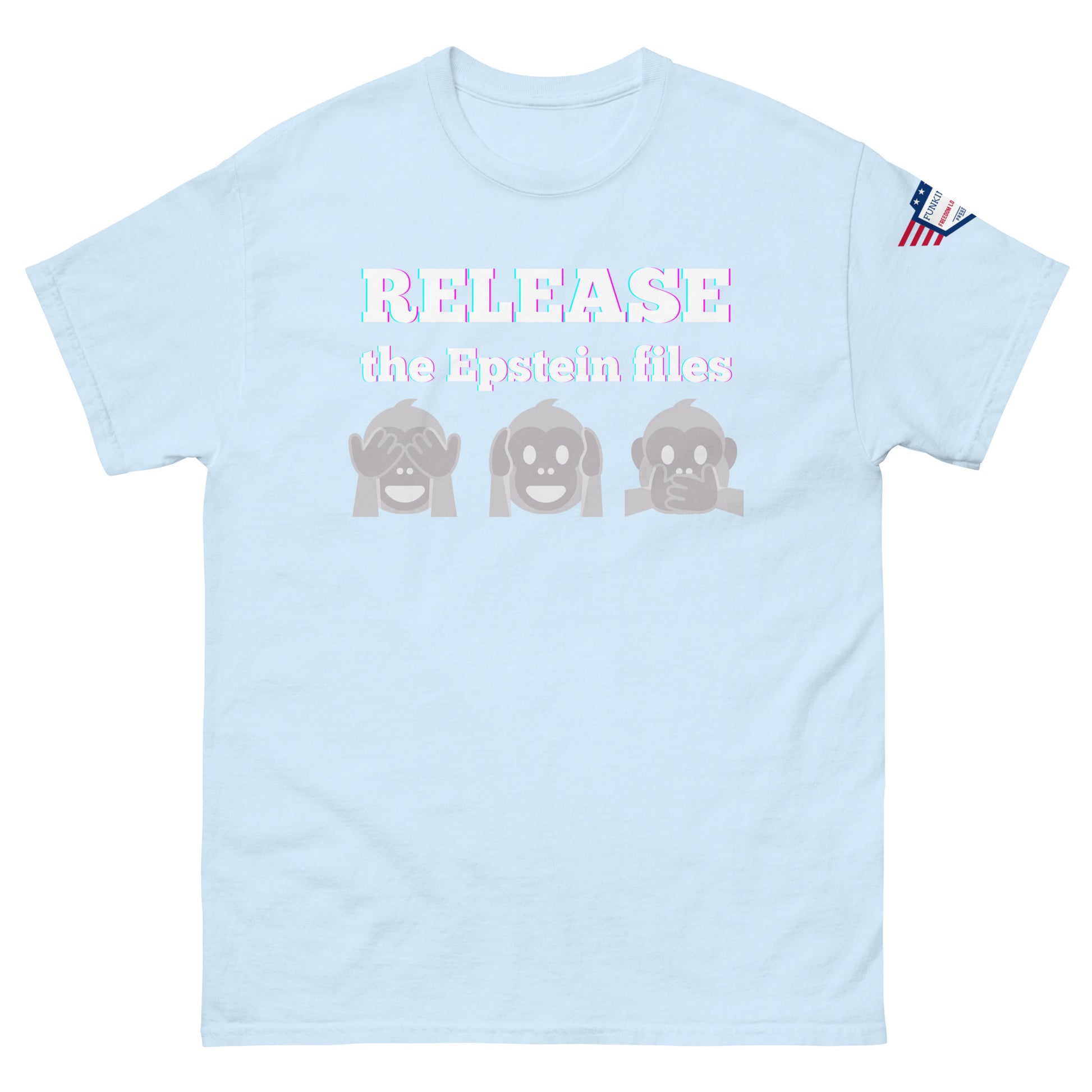 Front view of light blue-gray t-shirt with "RELEASEASE the Epstein files" gradient text and gray see-no-evil monkeys, US flag sleeve patch