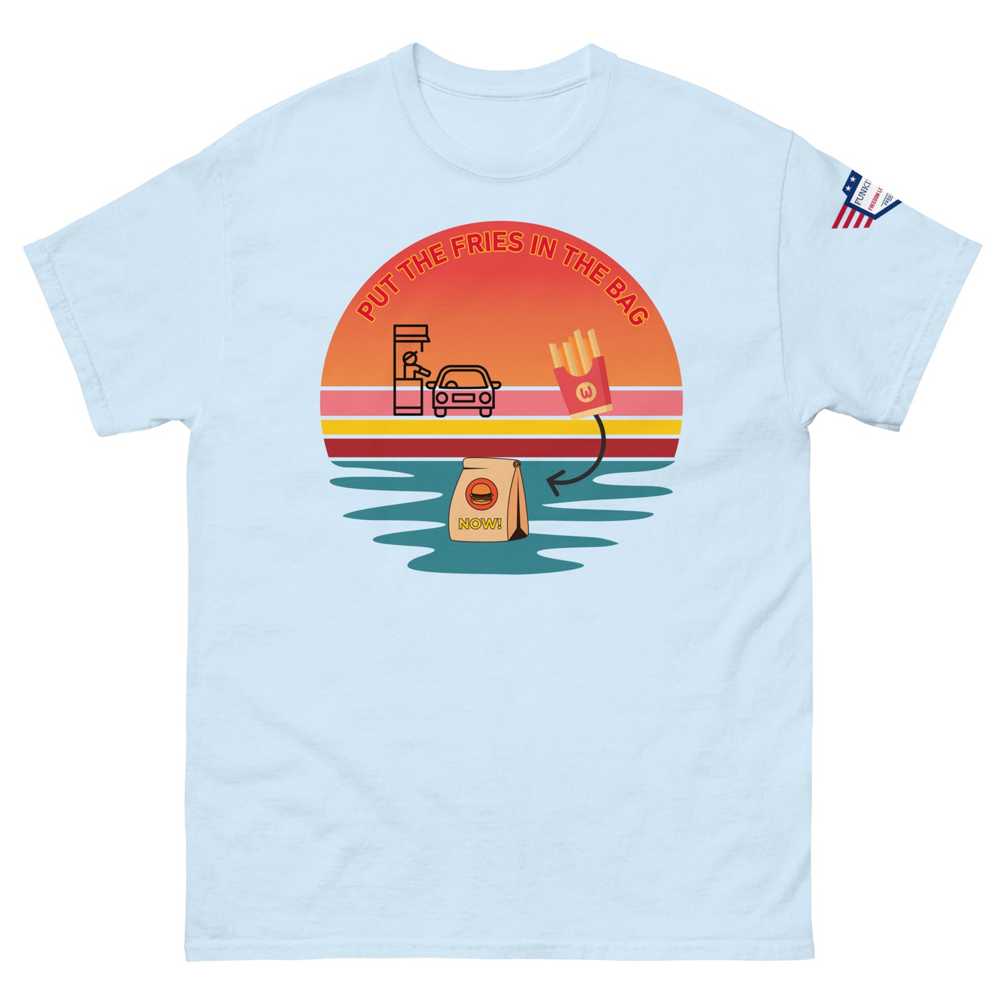 Front view of light blue unisex T-shirt with "PUT THE FRIES IN THE BAG" retro sunset drive-thru meme print and US flag sleeve patch