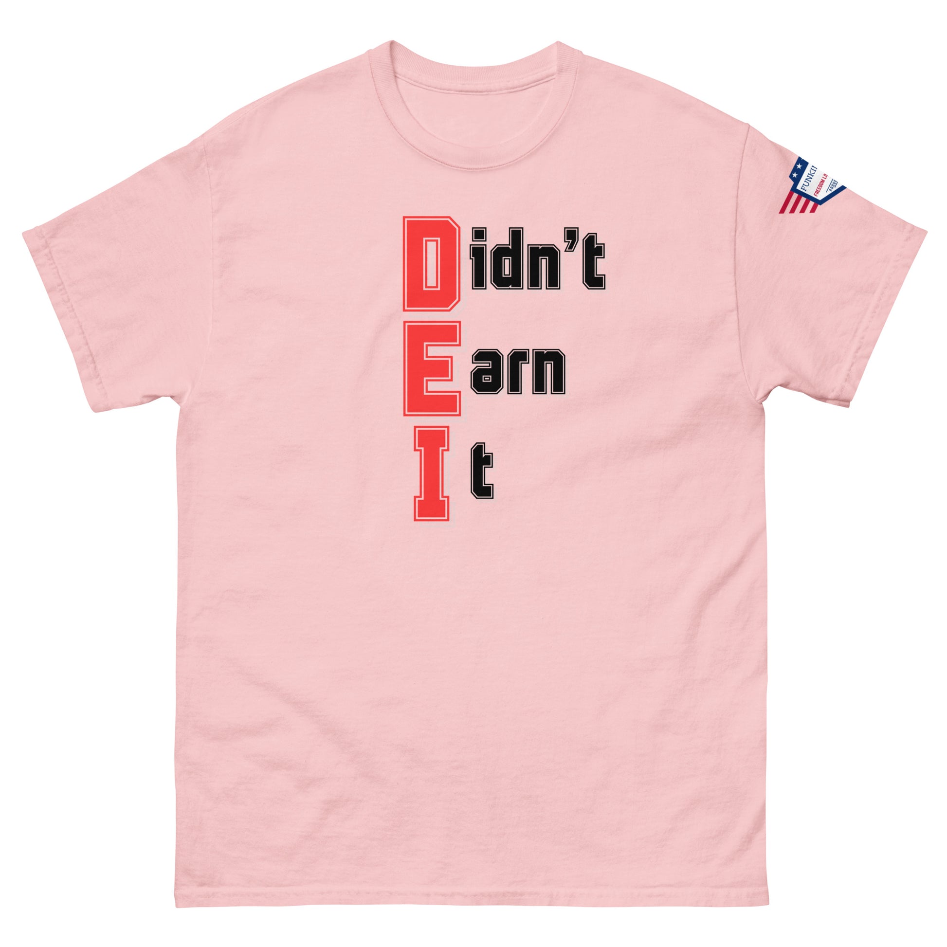 Front view of light pink unisex t-shirt with bold "Didn't Earn It" red-and-black graphic, stars-and-stripes sleeve patch