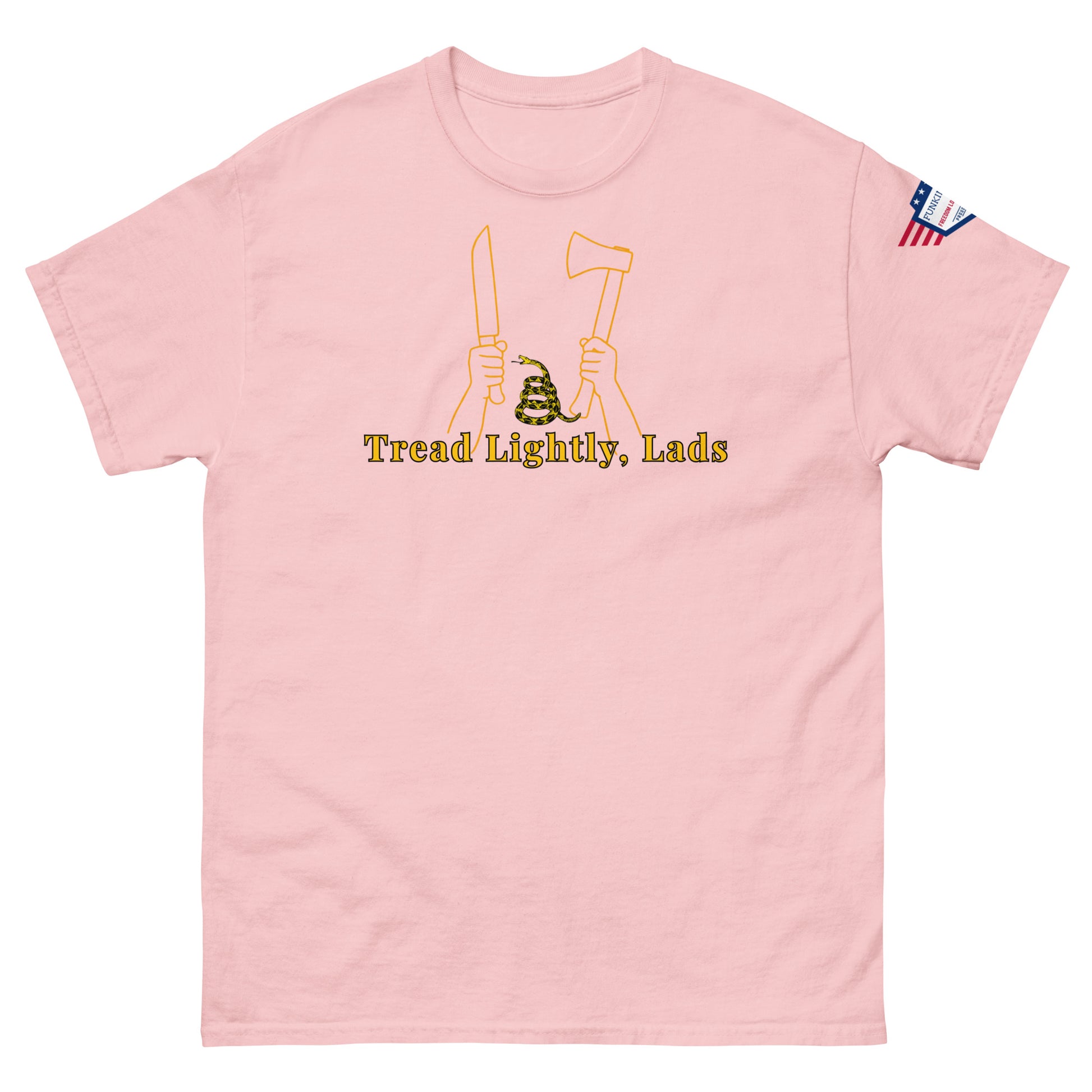 Front view of light pink unisex tee with "Tread Lightly, Lads" yellow print, hands gripping knife & axe flanking Gadsden snake, flag sleeve patch