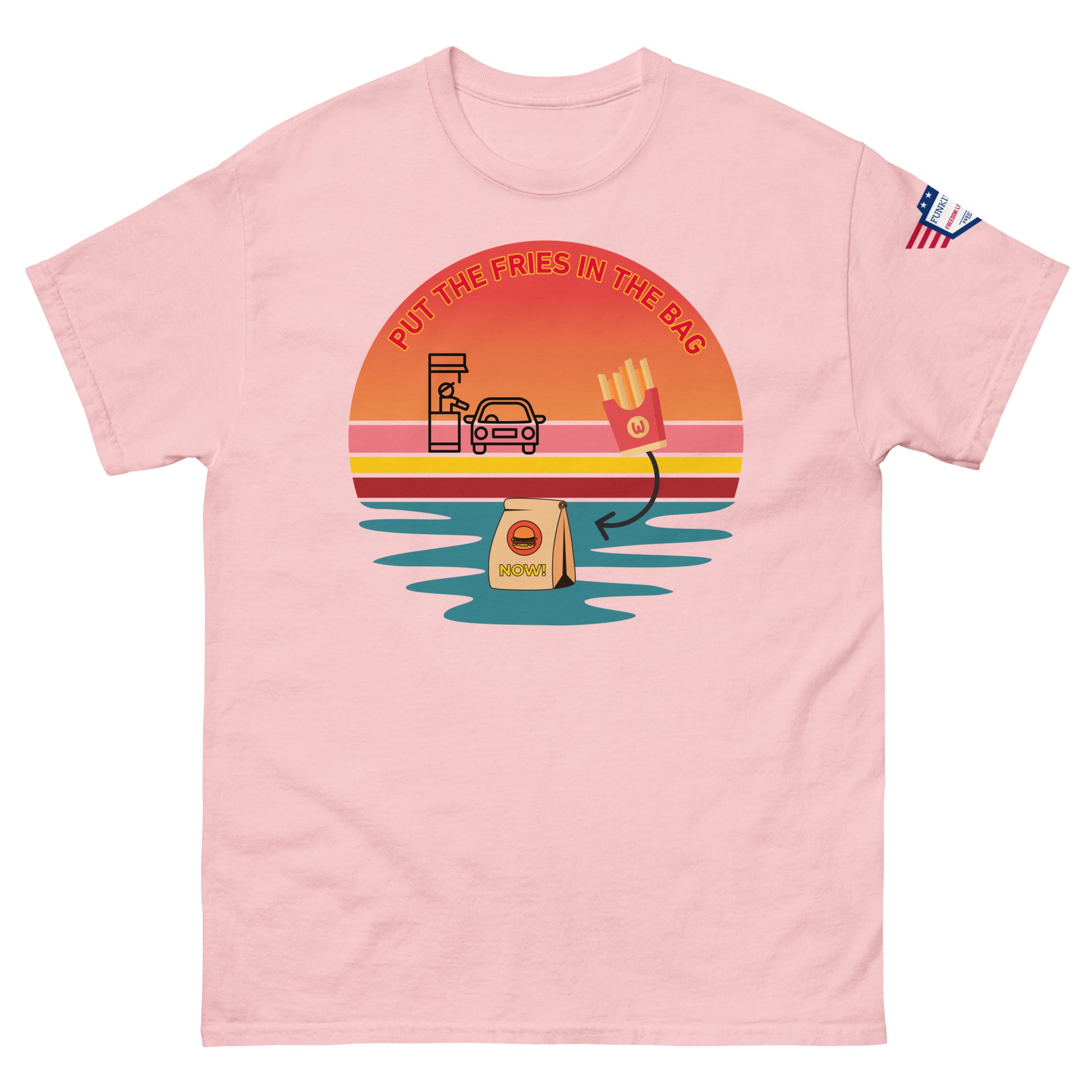 Front view of pink unisex T-shirt rocking "PUT THE FRIES IN THE BAG" drive-thru sunset graphic, McD bag, fries and flag patch