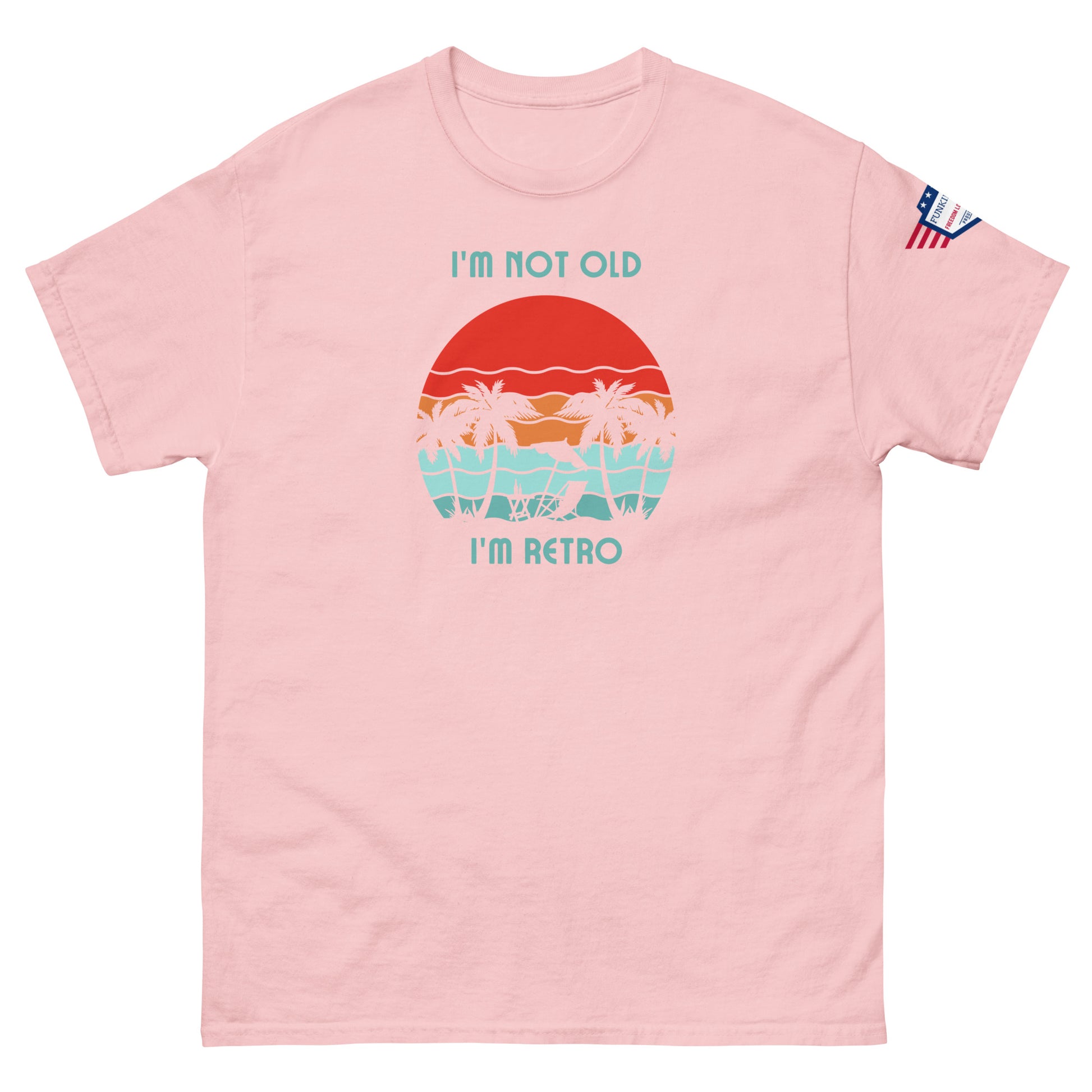 Front view of light pink "I'm Not Old I'm Retro" unisex tee featuring retro sunset graphic and flag sleeve detail