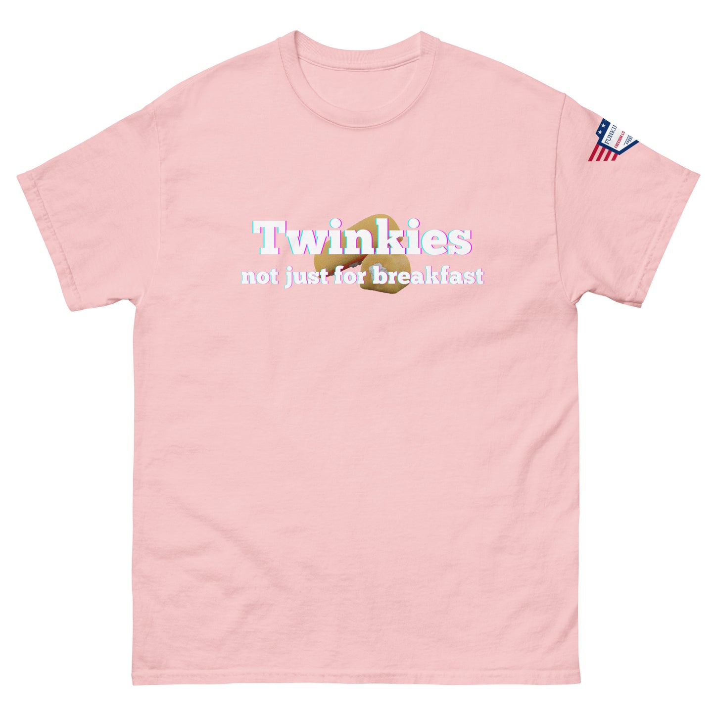 Front view of light pink unisex tee featuring "Twinkies not just for breakfast" text over Twinkie icon, flag on sleeve