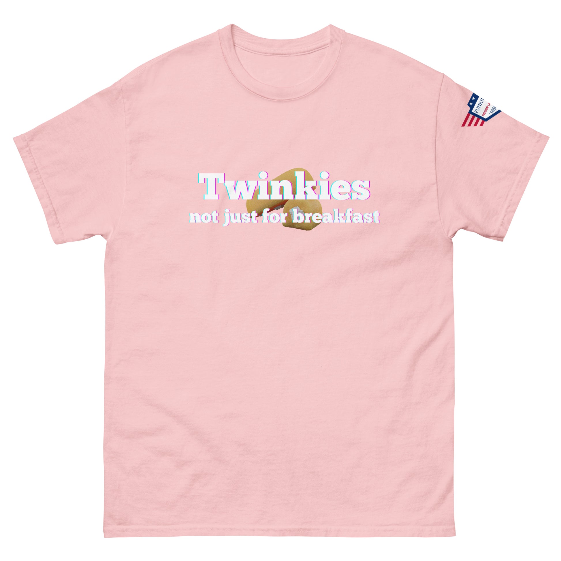 Front view of light pink unisex tee featuring "Twinkies not just for breakfast" text over Twinkie icon, flag on sleeve