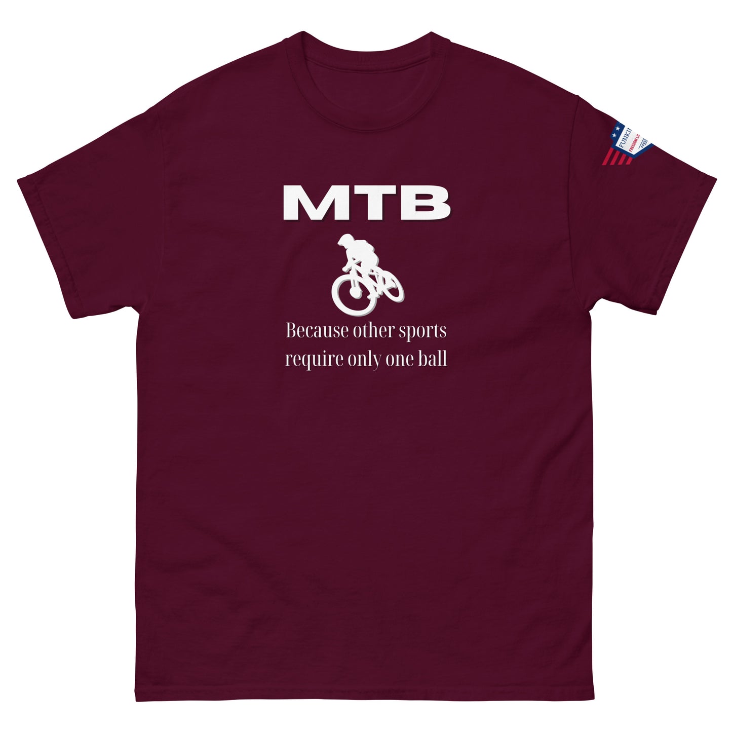Front view of maroon t-shirt showing white "MTB", biker silhouette, "Because other sports require only one ball" slogan, flag sleeve label