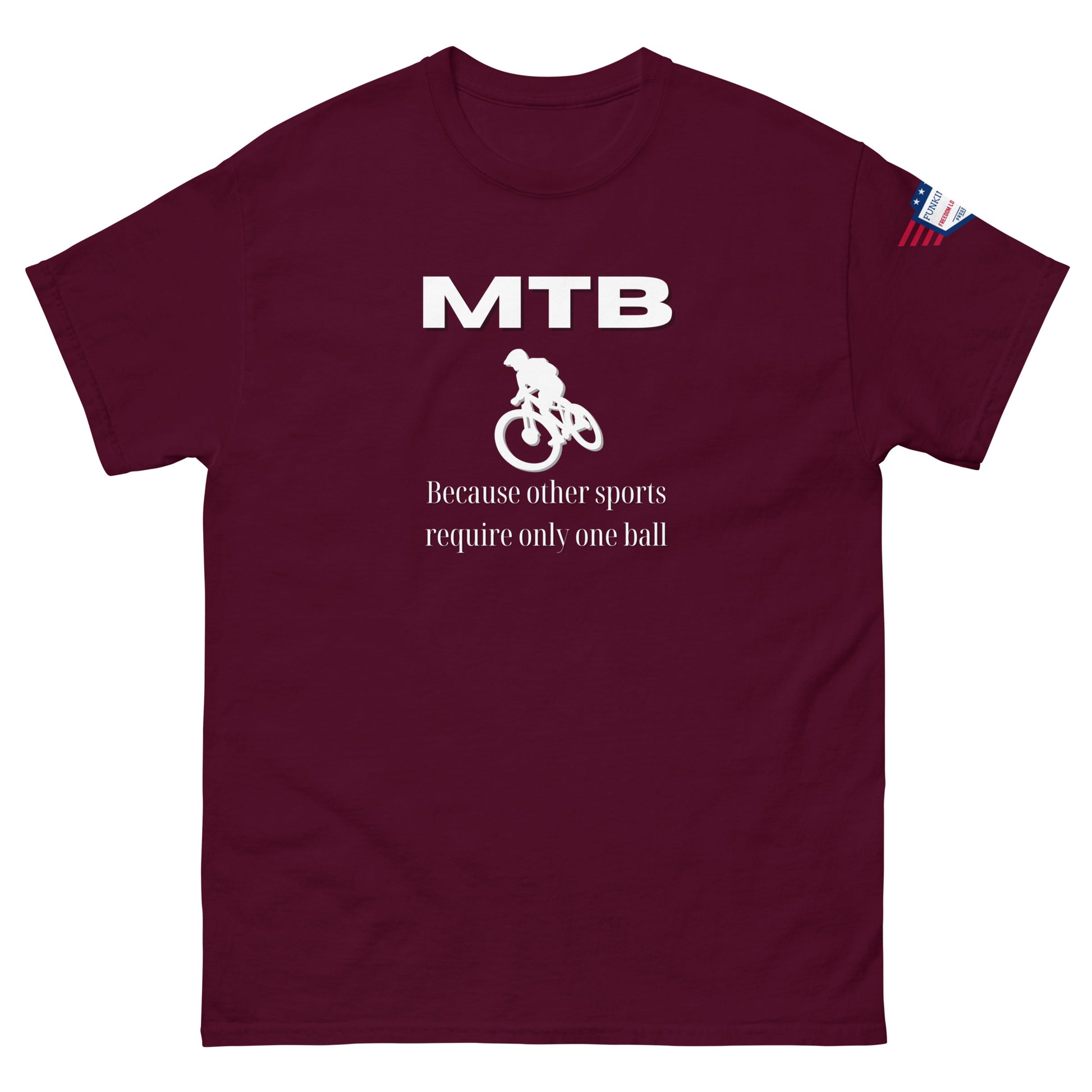 Front view of maroon t-shirt showing white "MTB", biker silhouette, "Because other sports require only one ball" slogan, flag sleeve label