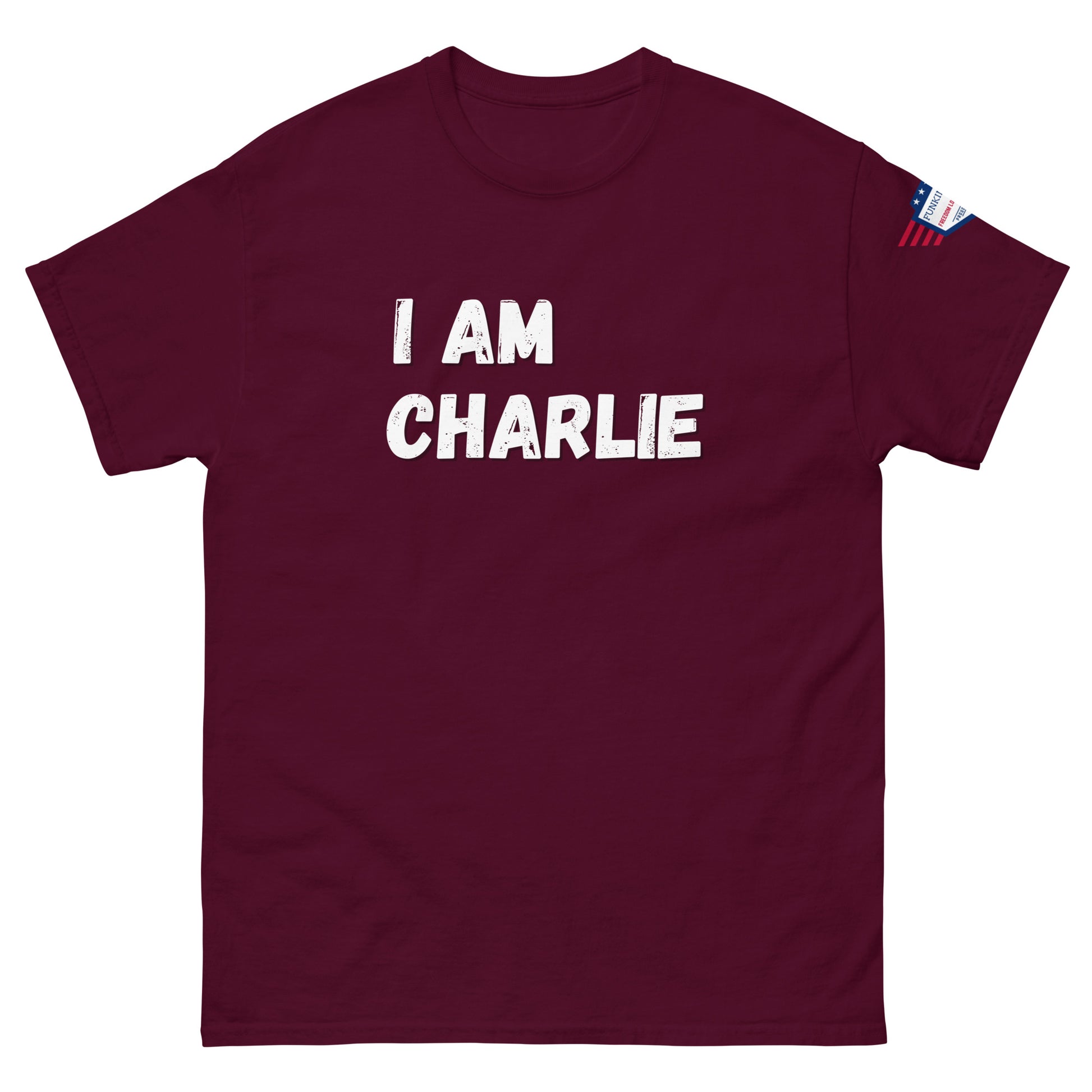 Maroon unisex tee front view, white "I AM CHARLIE" graphic and US flag detail