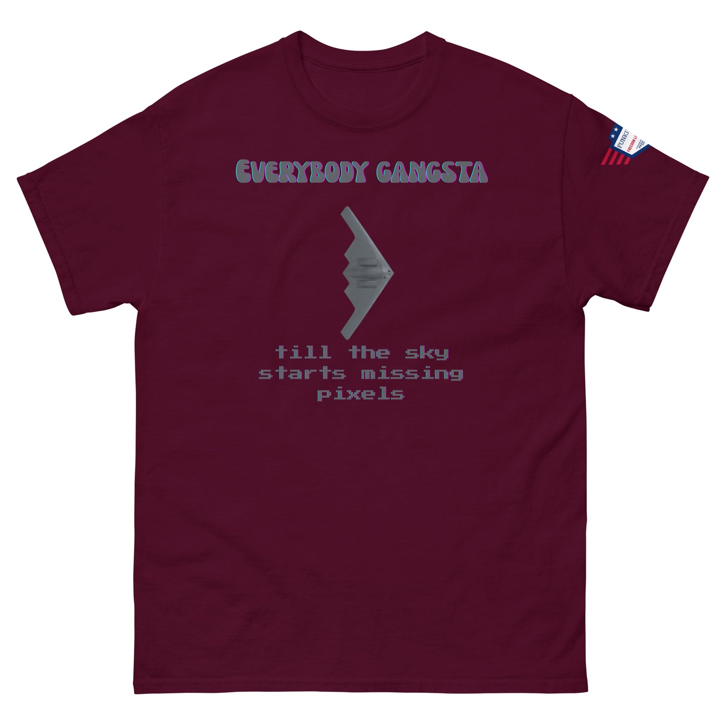 Front view of maroon "Everybody Gangsta till the sky starts missing pixels" tee with bomber graphic and US flag on right sleeve