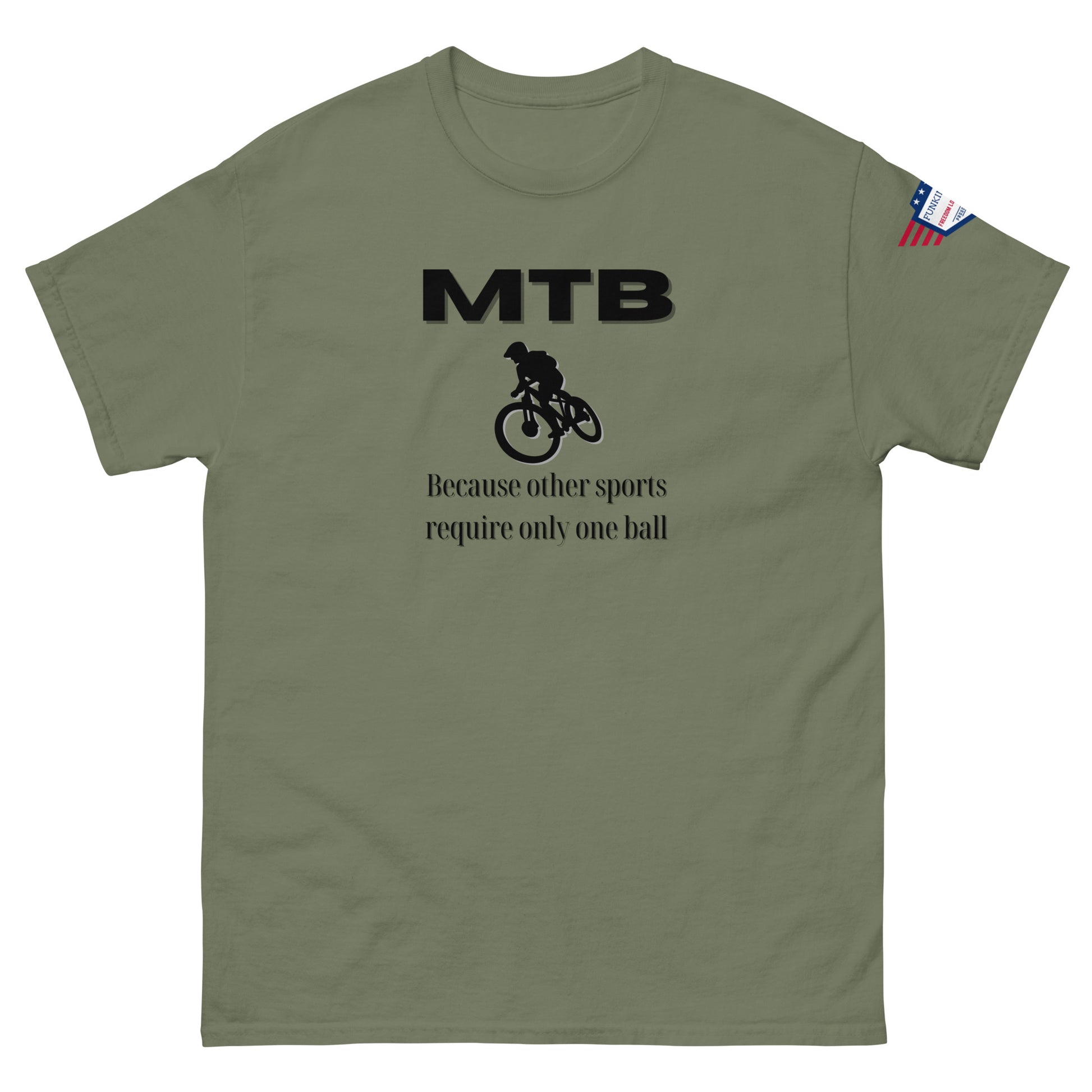 Khaki green tee front: "MTB" in black above biker icon and "Because other sports require only one ball" quip