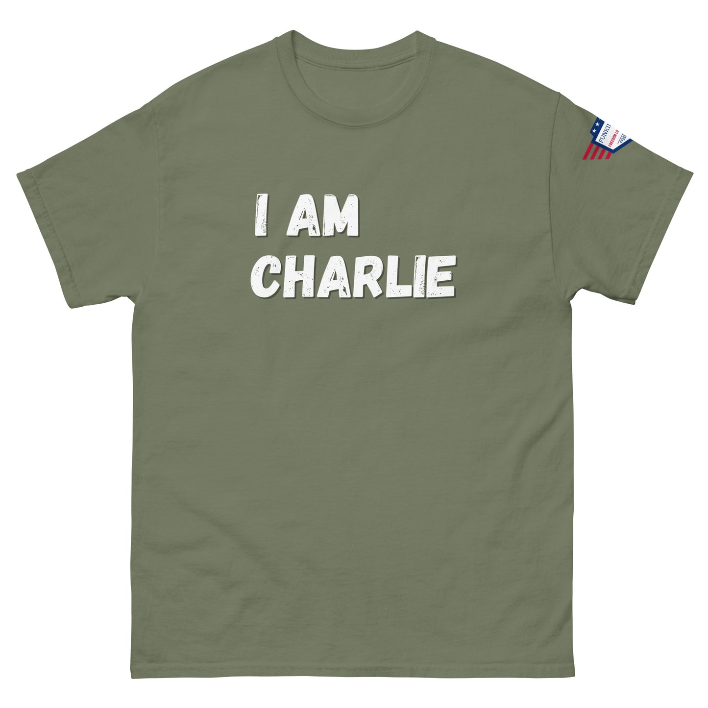 Olive green tee front, bold white "I AM CHARLIE" design, patriotic sleeve flag