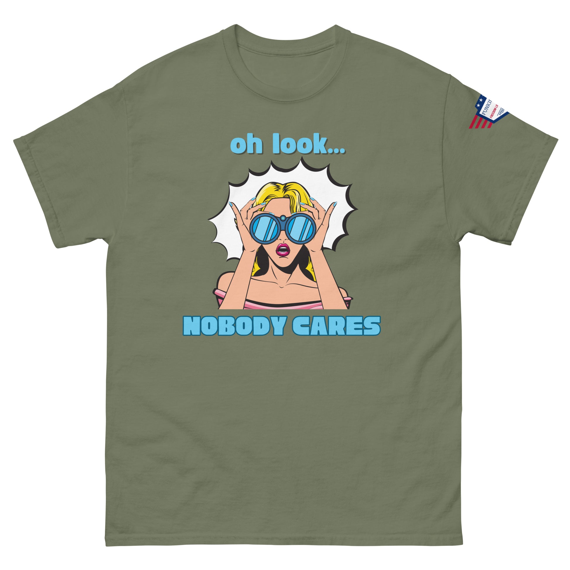 Front view of olive green unisex tee with bold "oh look... NOBODY CARES" pop art and tiny USA flag sleeve patch