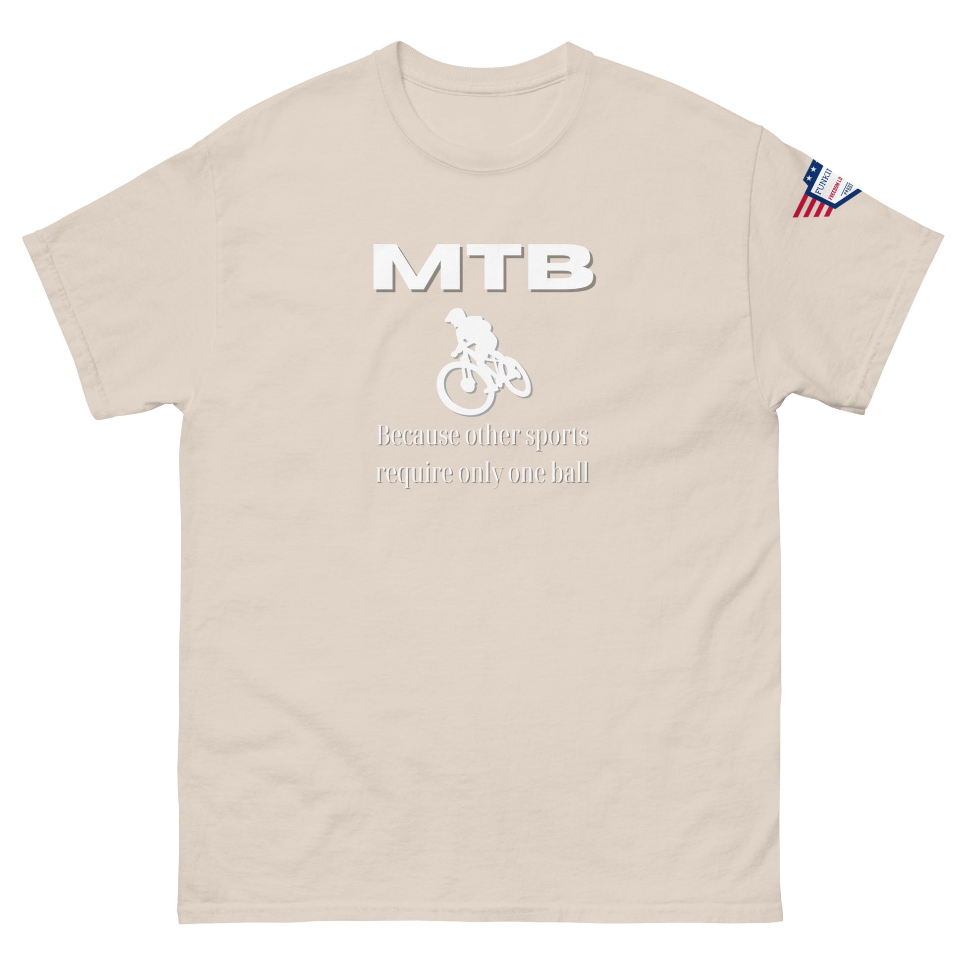 Front view of beige unisex t-shirt with white "MTB", MTB rider silhouette, "Because other sports require only one ball", flag on sleeve