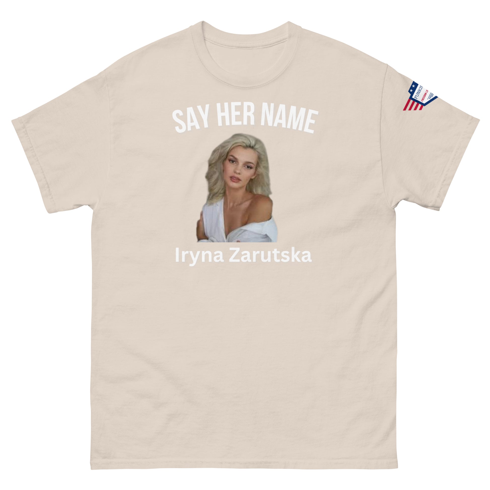 Front view of ash gray unisex tee with "SAY HER NAME" top text, Iryna Zarzutska portrait center, name bottom, US flag patch