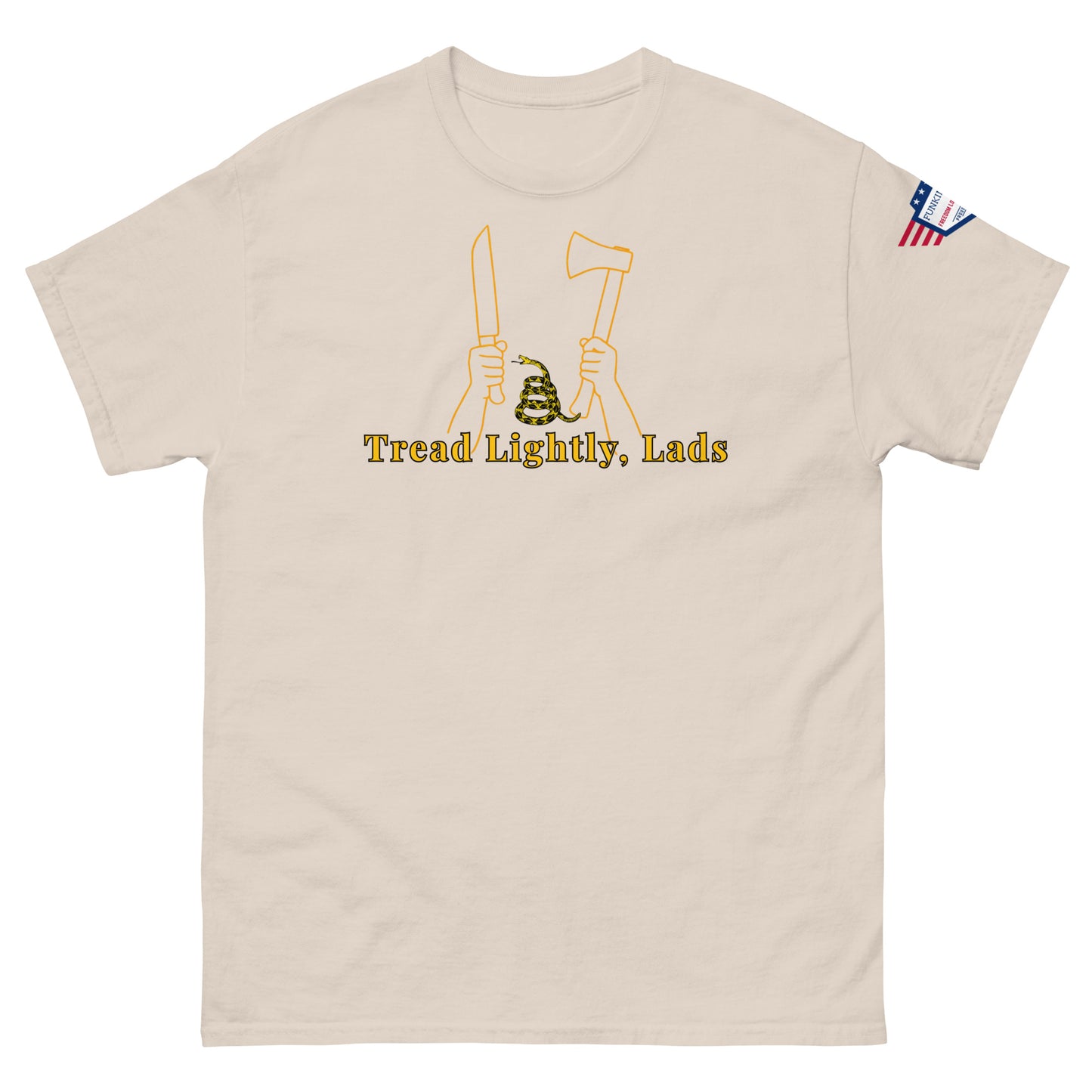 Front view of natural tan unisex tee with "Tread Lightly, Lads" yellow graphic: knife, axe, coiled snake between hands, US flag patch