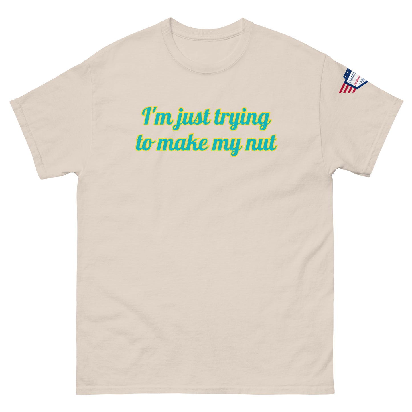 Front view of beige tee with "I'm just trying to make my nut" in teal script and US flag sleeve patch