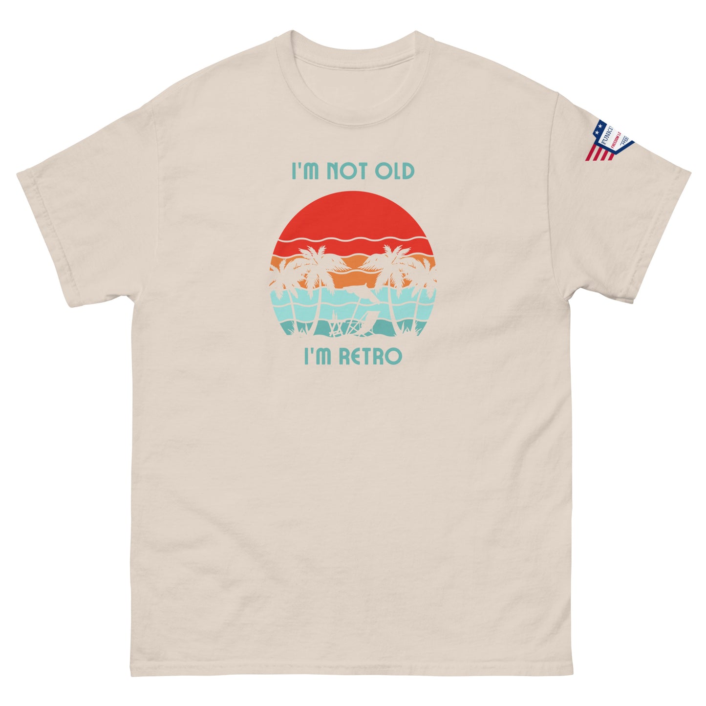 Front view of beige "I'm Not Old I'm Retro" tee with colorful sunset palms and subtle USA sleeve patch