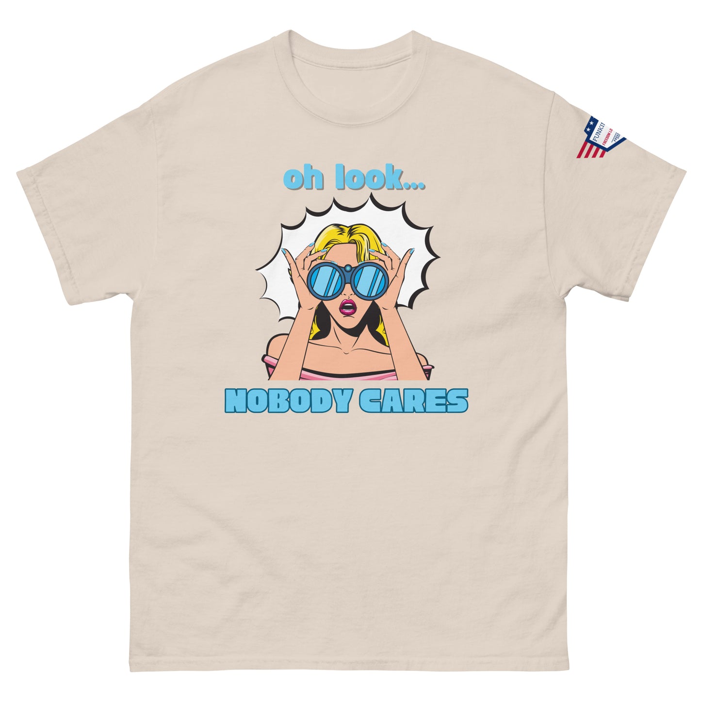 Front view of ash gray unisex t-shirt boasting "oh look... NOBODY CARES" sarcastic pop-art print, flag patch