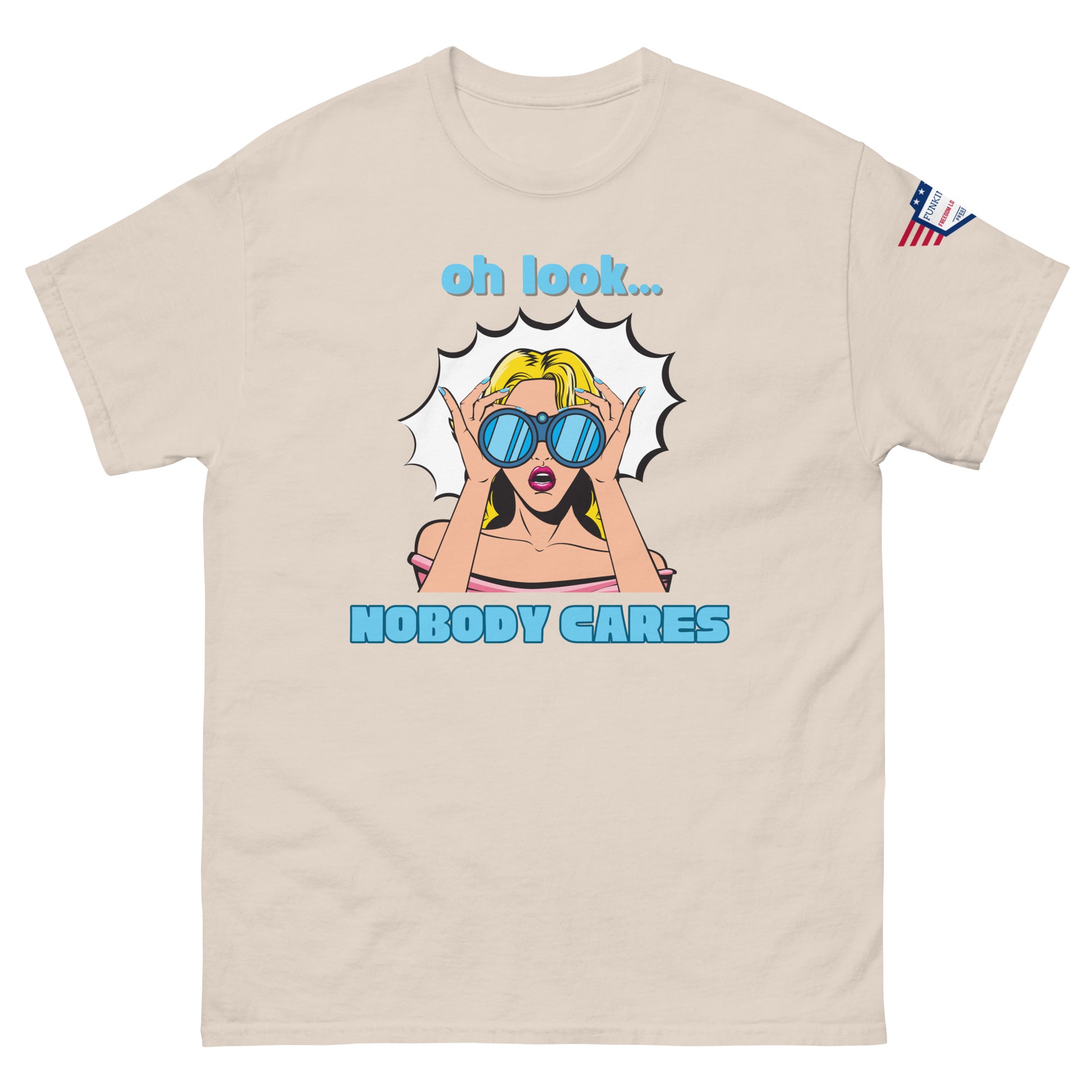 Front view of ash gray unisex t-shirt boasting "oh look... NOBODY CARES" sarcastic pop-art print, flag patch