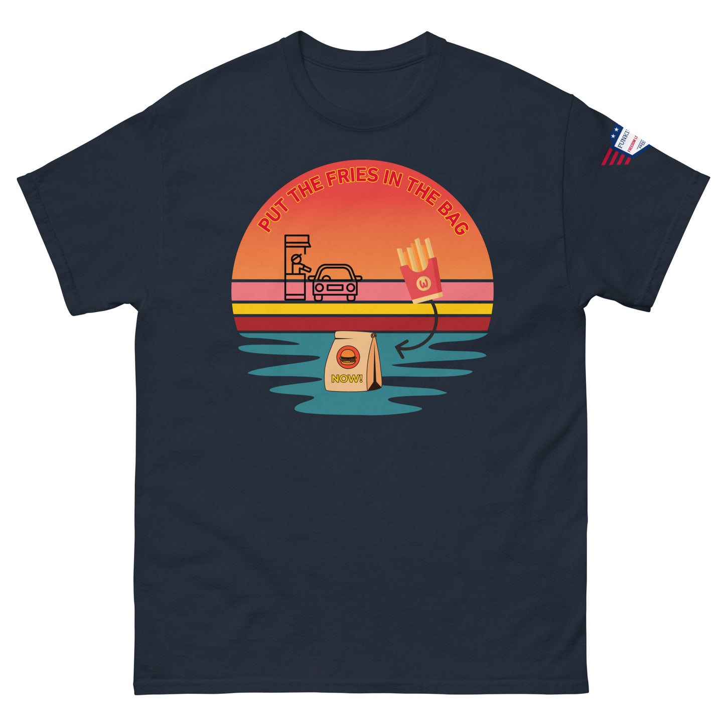 Front view of navy blue tee with bold "PUT THE FRIES IN THE BAG" retro sunset drive-thru graphic and flag sleeve patch