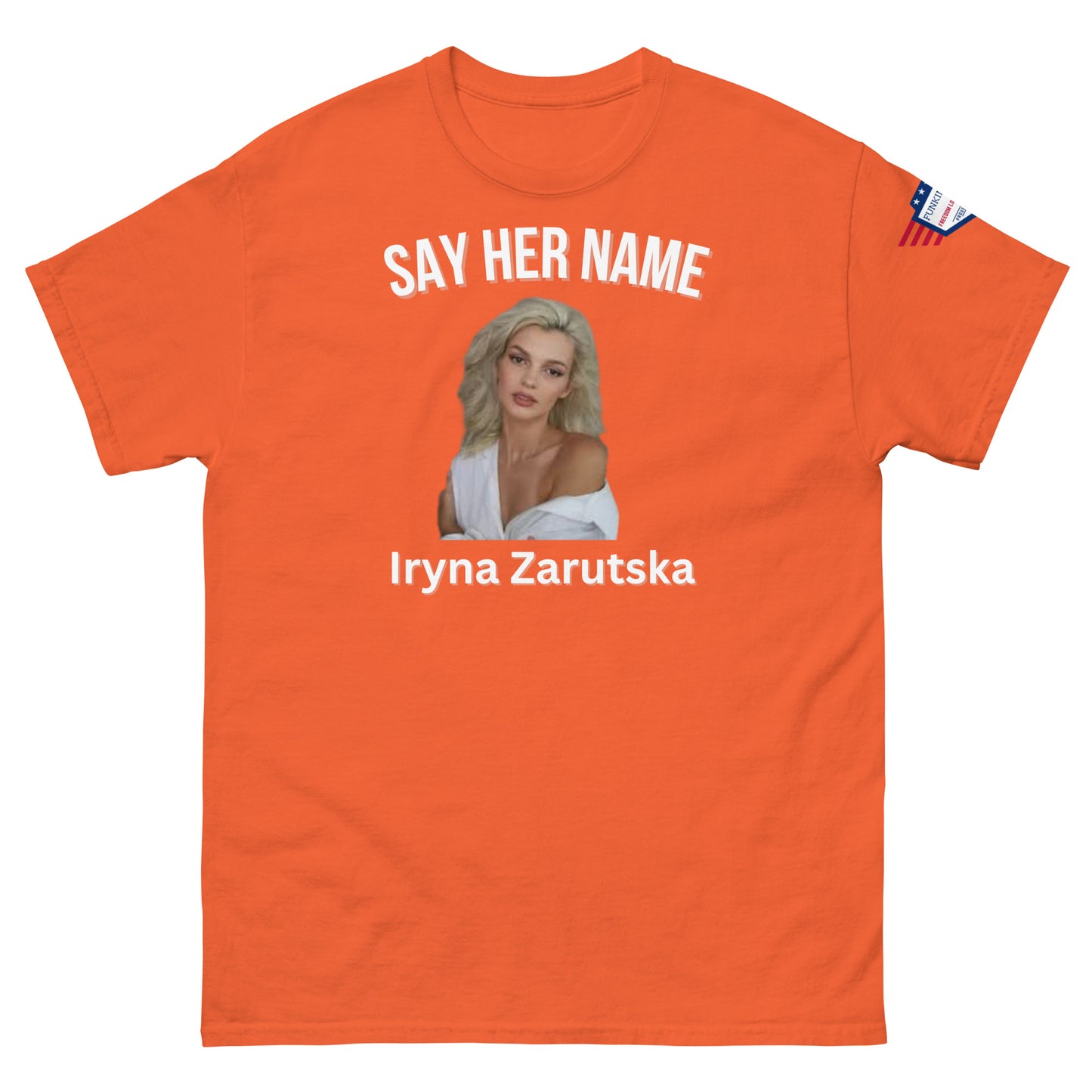 Front view of orange classic fit tee with white "SAY HER NAME", Iryna Zarzutska blonde portrait, text and US flag patch