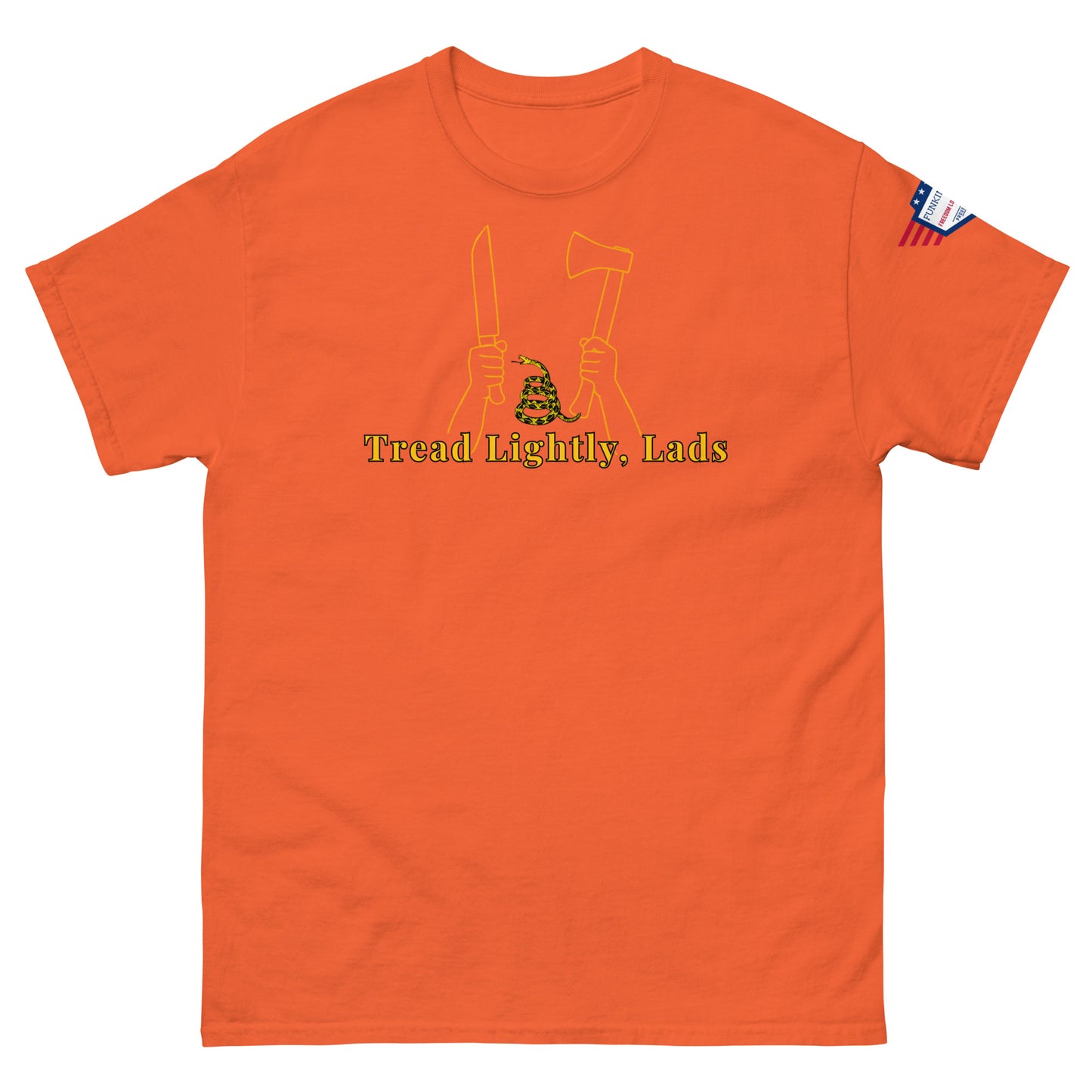 Front view of orange unisex tee displaying "Tread Lightly, Lads" yellow design: knife & axe hands with coiled Gadsden snake, flag patch